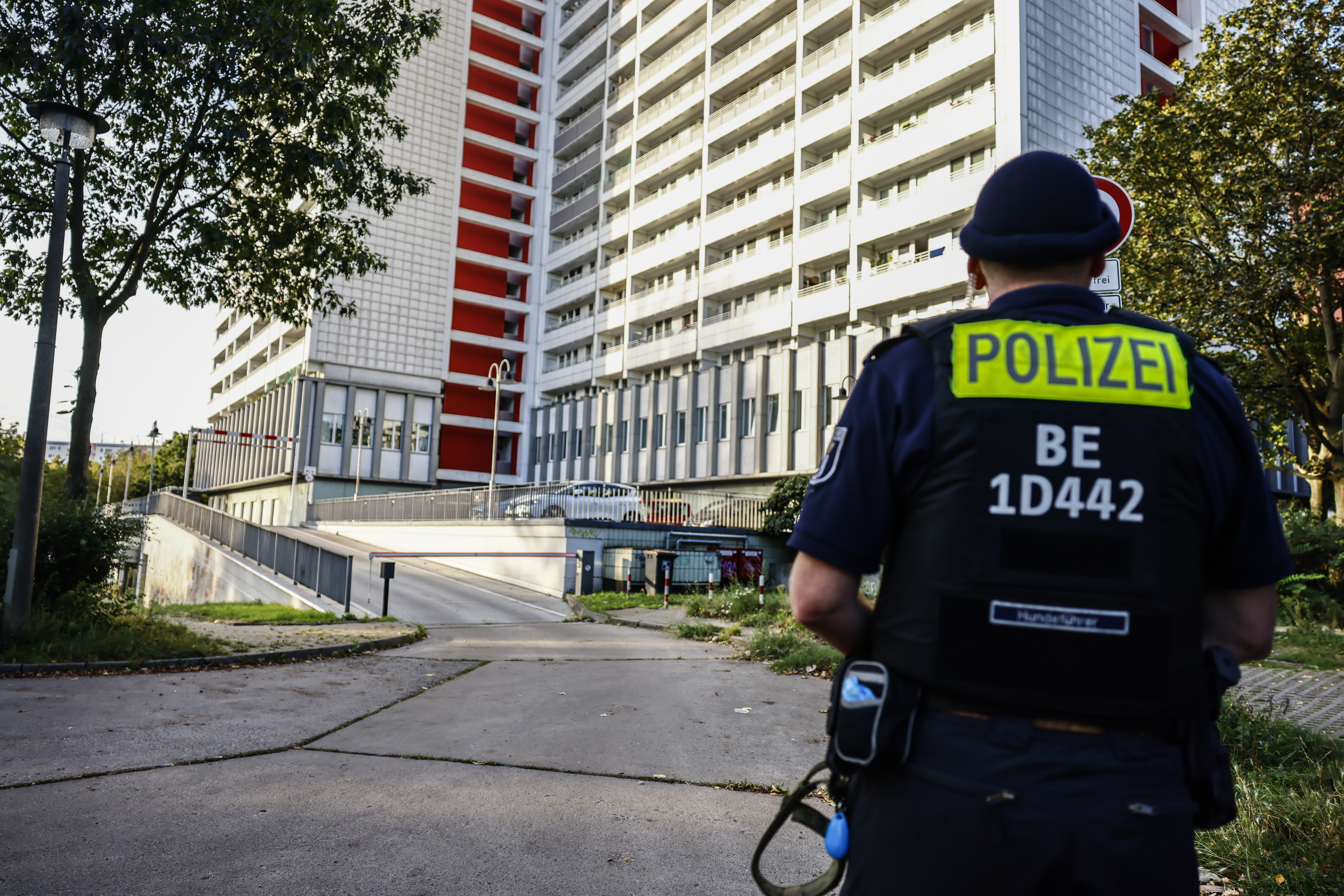 A police officer during a raid in the east part of Berlin, Germany
