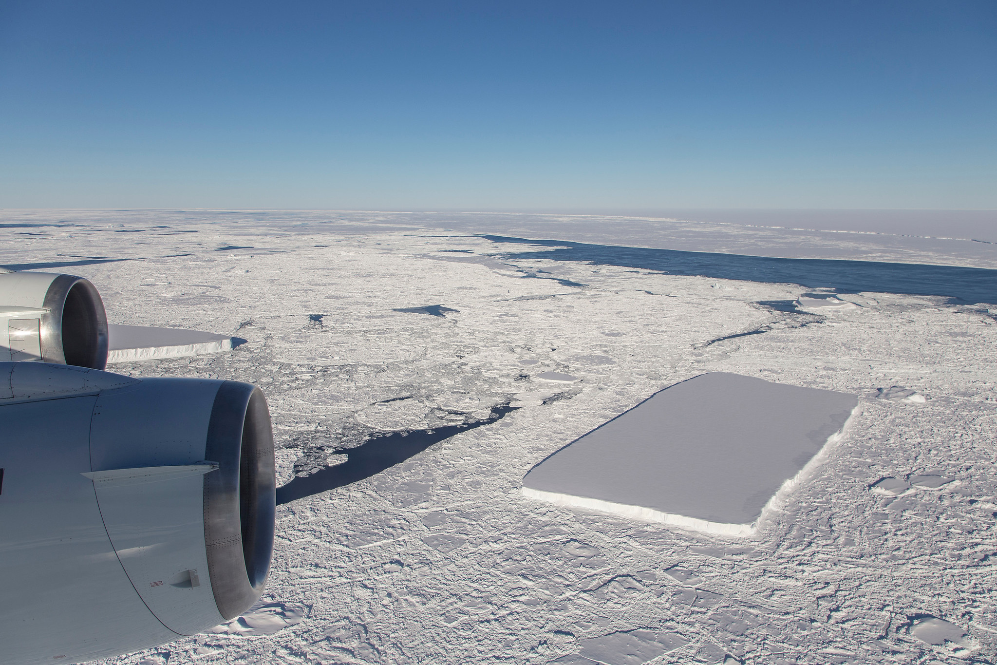 A sharp-angled, tabular iceberg floats among sea ice just off of the Larsen C ice shelf in the northern Antarctic Peninsula, October 16, 2018. Picture taken October 16, 2018. NASA/Jeremy Harbeck/Handout via REUTERS ATTENTION EDITORS - THIS IMAGE WAS PROVIDED BY A THIRD PARTY.