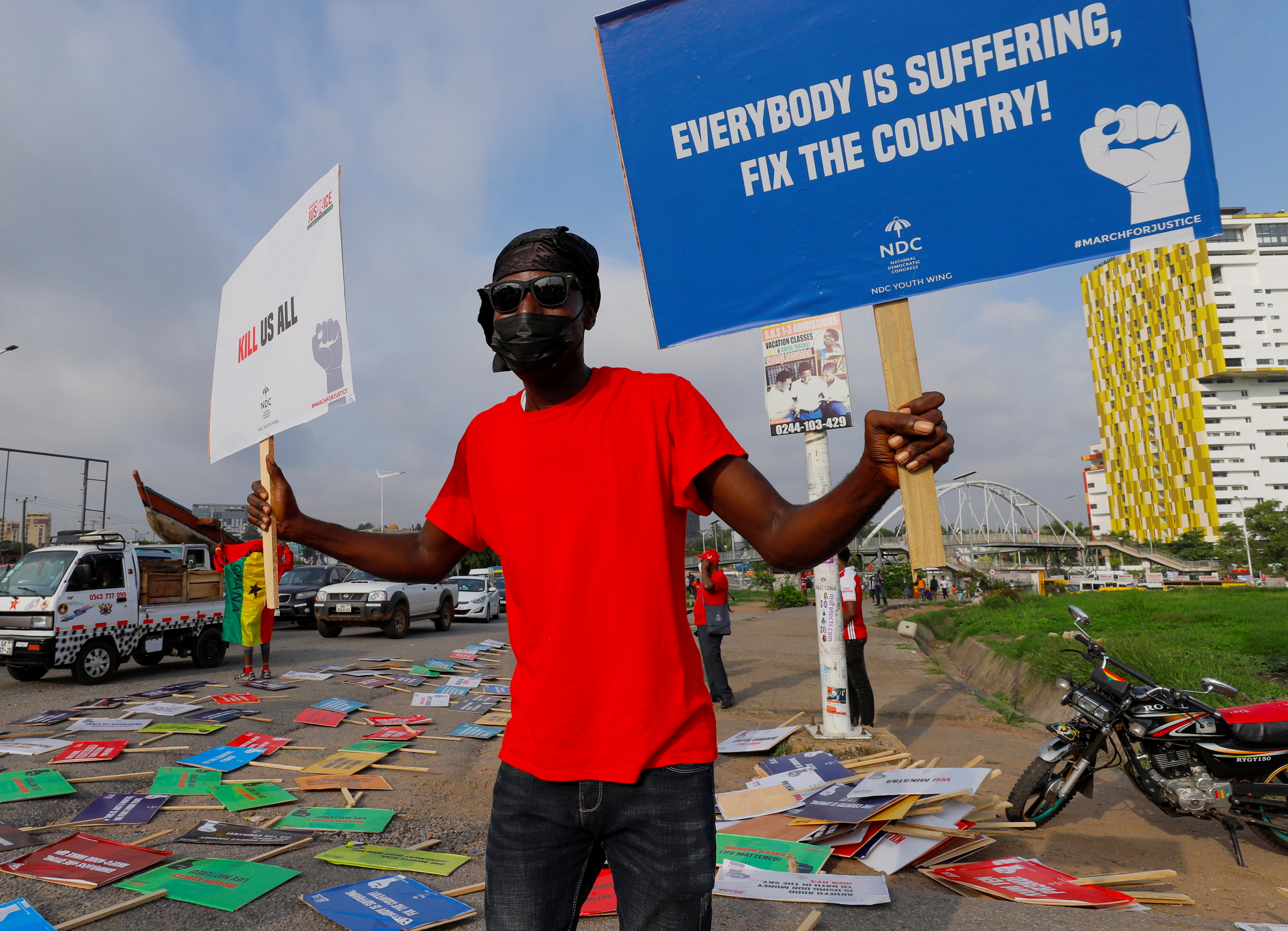 A supporter of Ghana's main opposition party, the National Democratic Congress (NDC) attends a protest