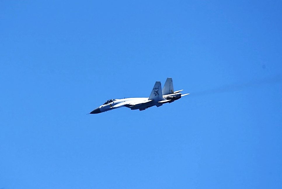 A Chinese J-15 fighter against a blue sky