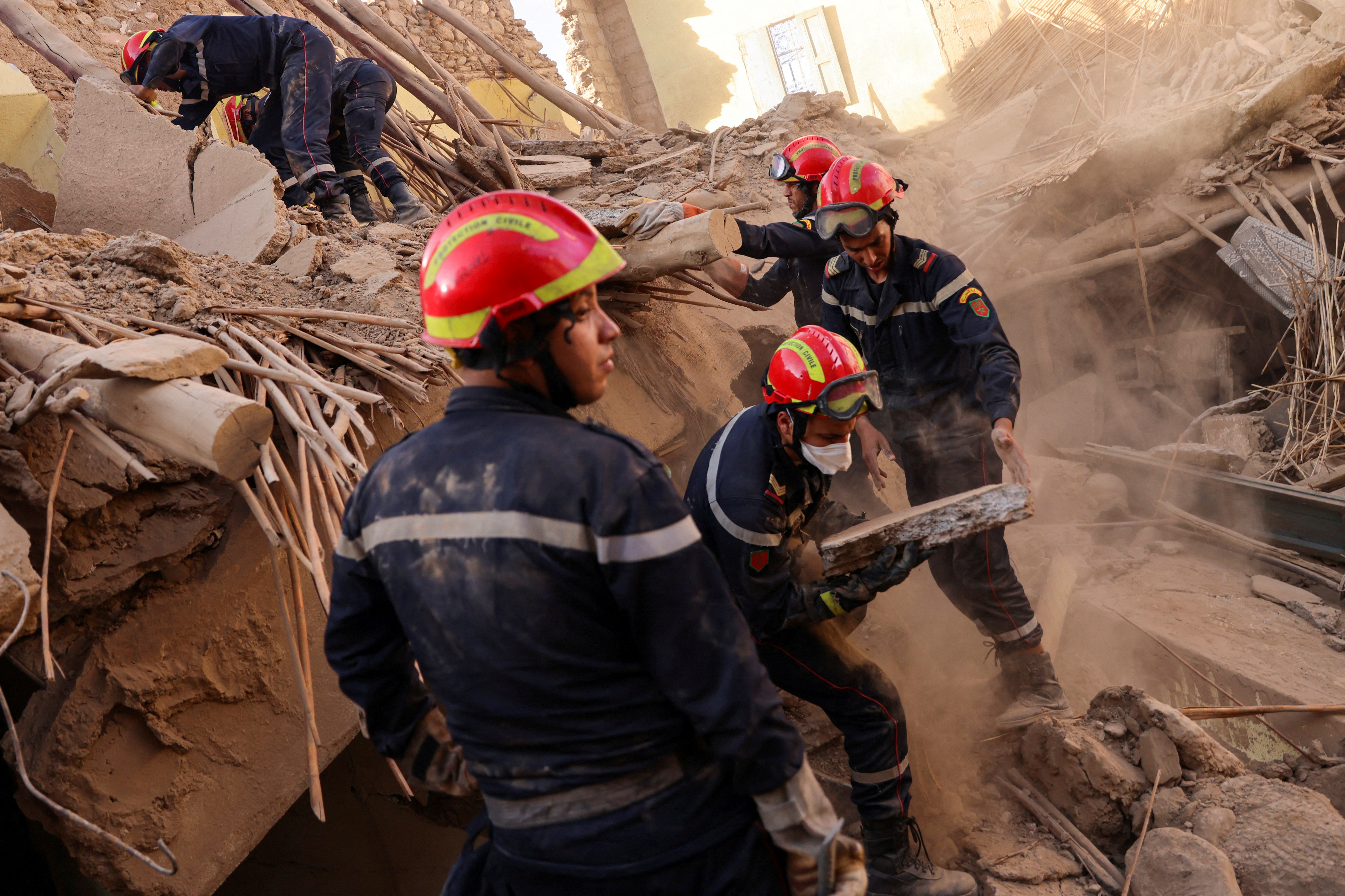 Rescue workers at the site of a collapsed building in in Amizmiz