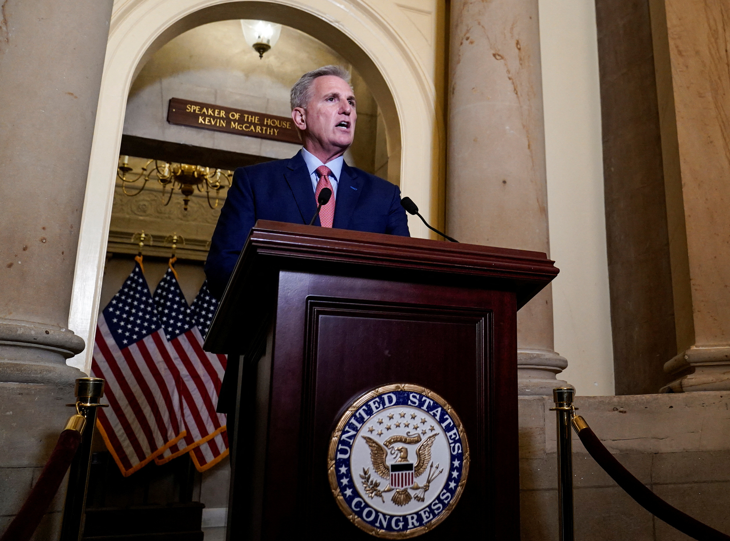 US House Speaker Kevin McCarthy speaks at a podium
