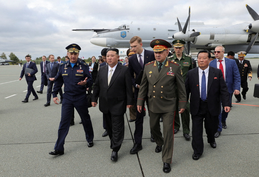 North Korea's leader Kim Jong Un, centre, and Russia's Defence Minister Sergei Shoigu, right, inspect Russian military aircraft and missiles put on display at Knevichi aerodrome near Vladivostok in the Primorsky region, Russia, on September 16, 2023 [Russian Defence Ministry/handout via Reuters]
