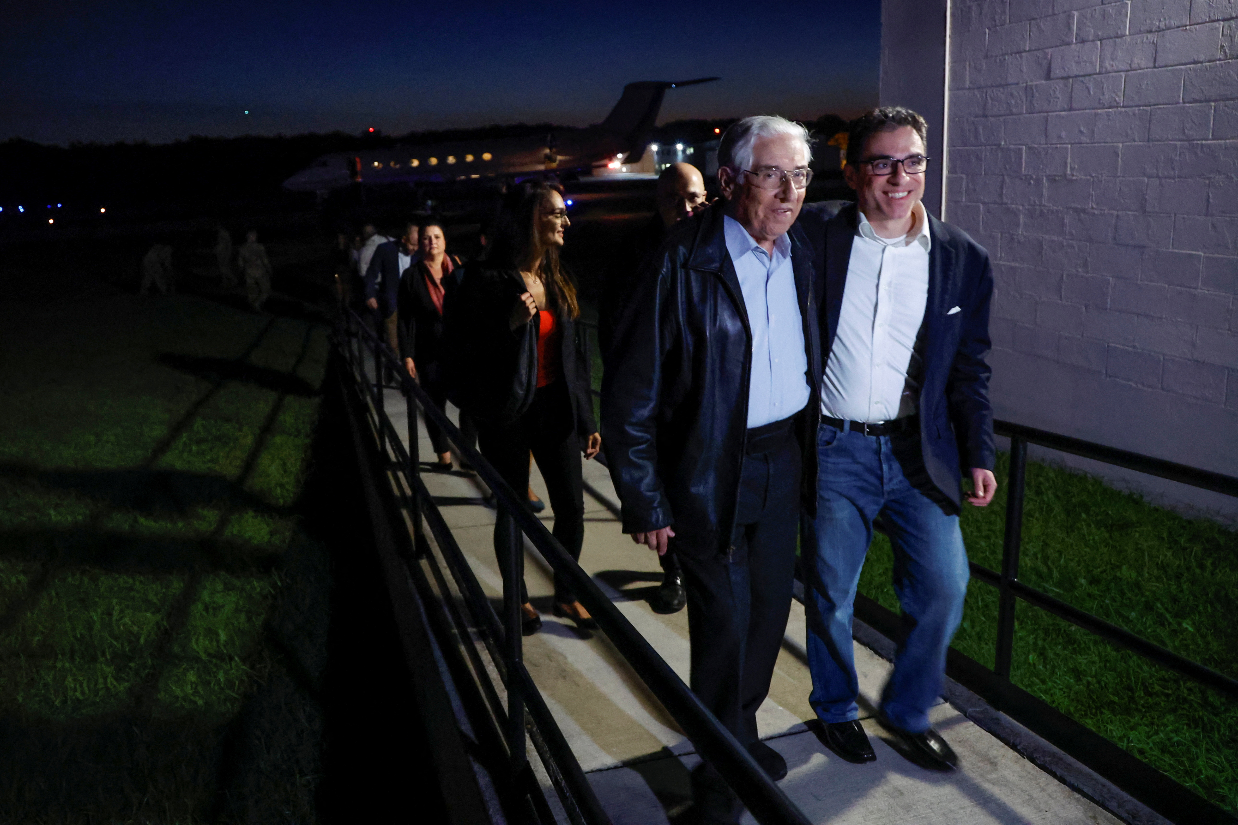A family member embraces freed American Siamak Namazi after he and four fellow detainees were released in a prisoner swap deal between US and Iran, and arrived at Davison Army Airfield at Fort Belvoir, Virginia, US, September 19, 2023