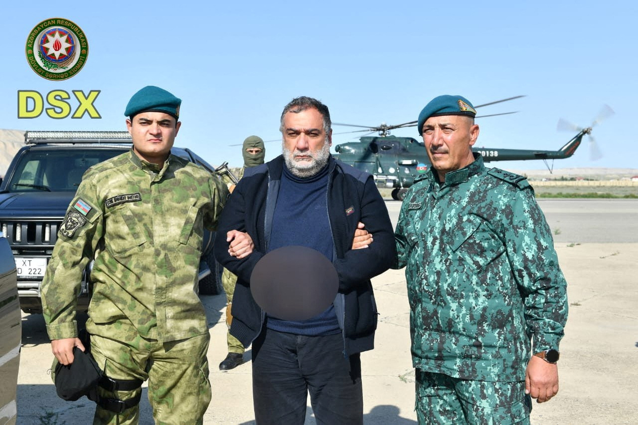 Ruben Vardanyan, a former top official in the separatist ethnic Armenian administration of Nagorno-Karabakh, is seen detained by Azerbaijan's border service personnel [State Border Service of Azerbaijan/Handout via Reuters]
