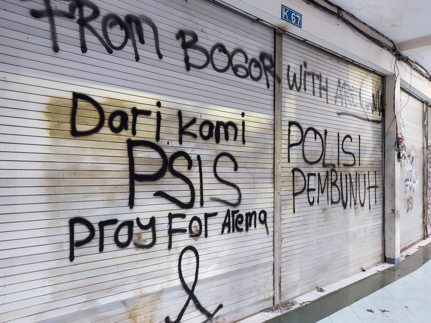 Graffiti at the stadium accuses the police of killing fans