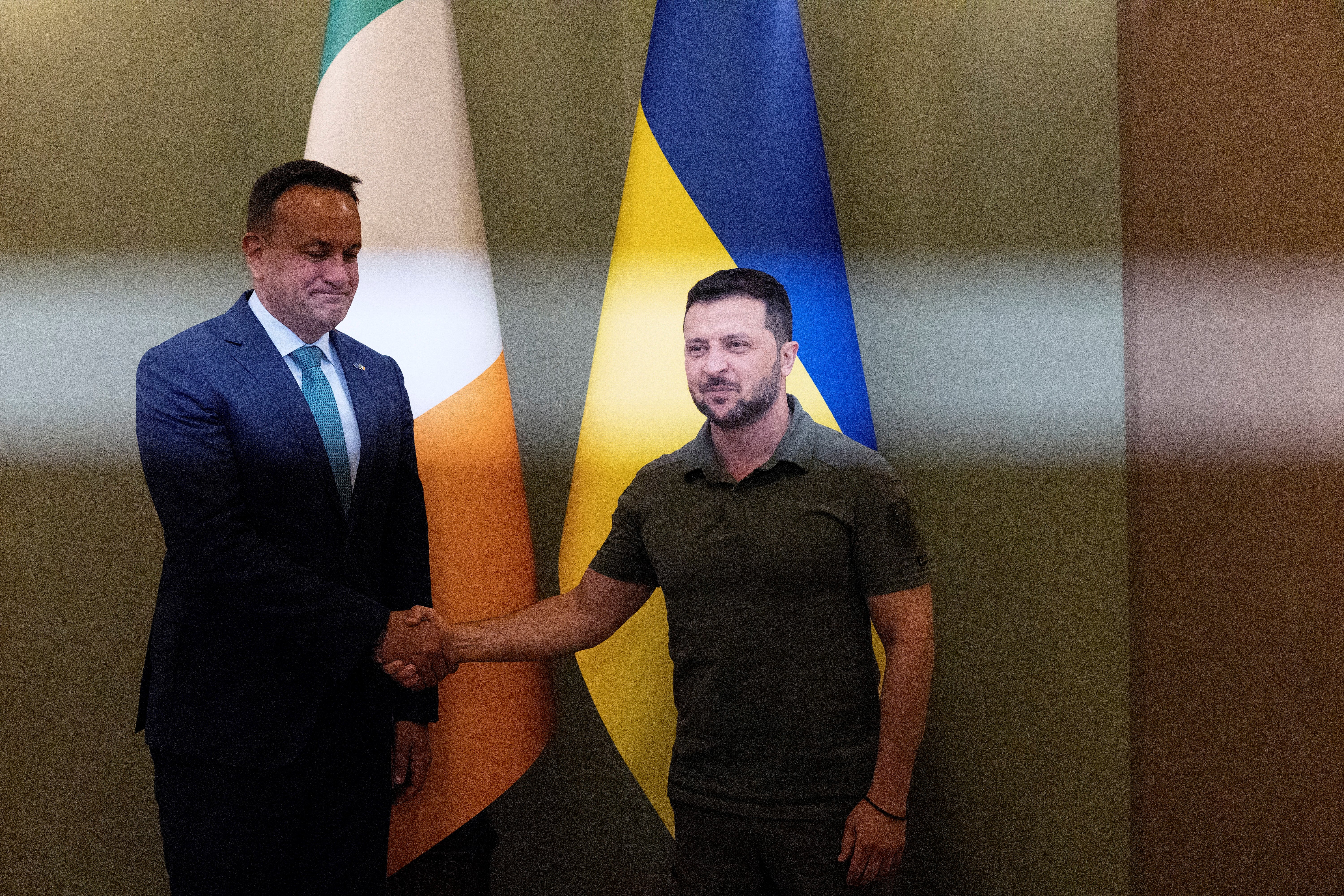 Ukraine's President Volodymyr Zelenskyy (R) and Ireland's Prime Minister Leo Varadkar shake hands during a meeting in Kyiv