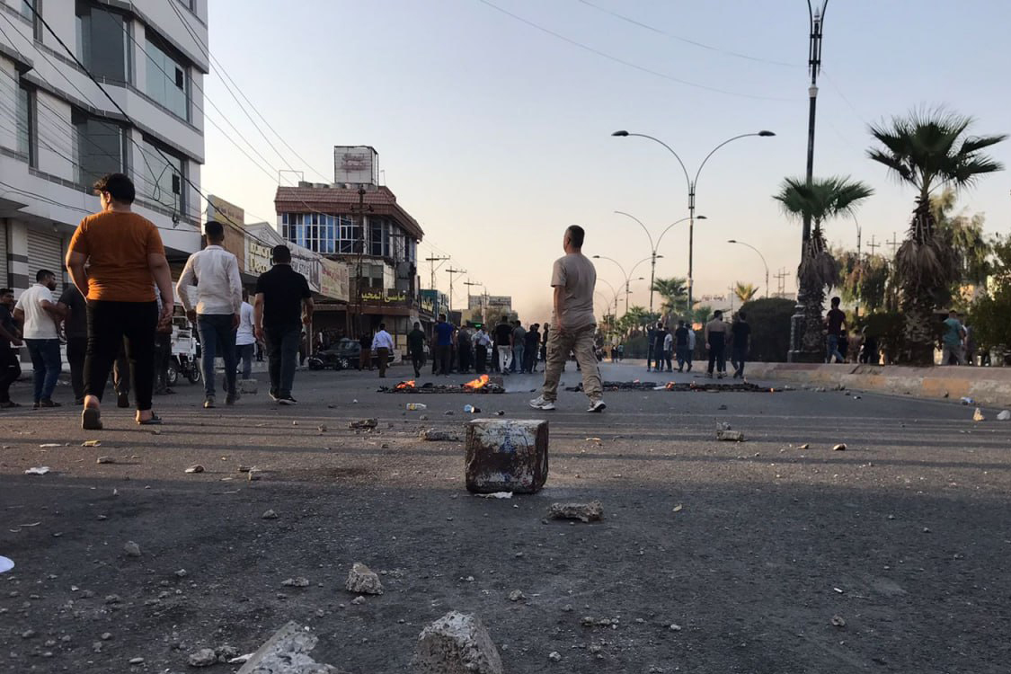 Iraqi protesters block a road following protests in the multi-ethnic Iraqi city of Kirkuk on September 2, 2023. - At least one civilian was killed and eight people were injured