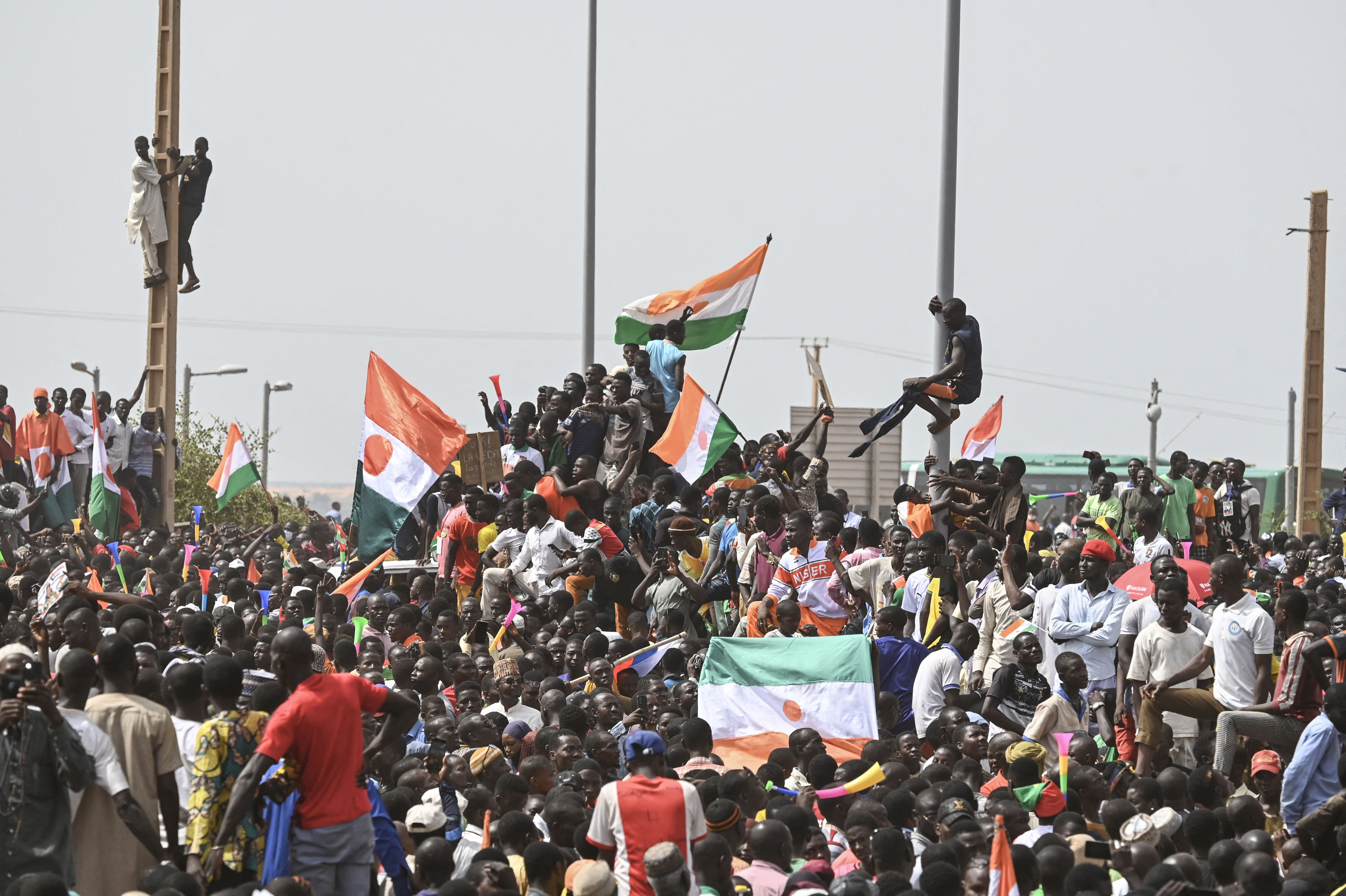 Supporters of Niger's National Council of Safeguard of the Homeland (CNSP) protest outside the Niger and French airbase in Niamey on September 2, 2023 to demand the departure of the French army from Niger.