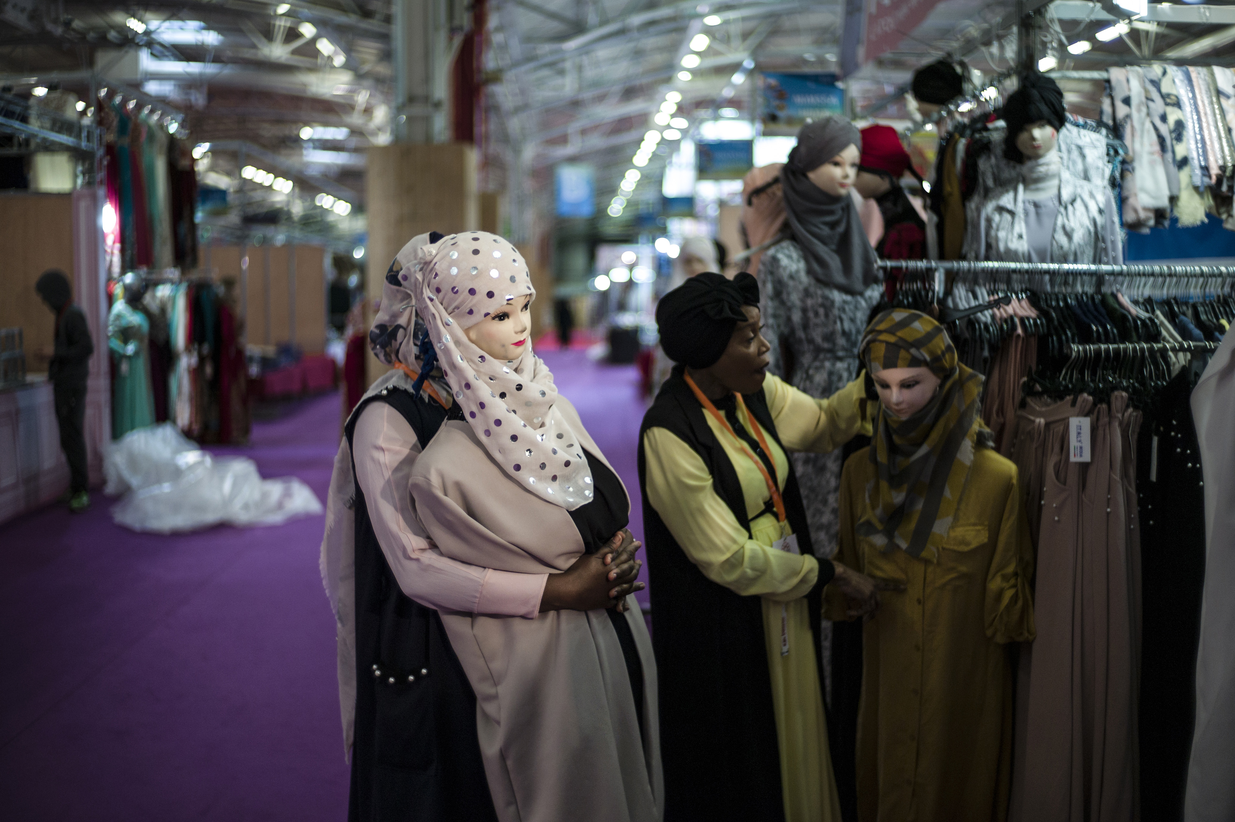 epa06637269 Storekeepers prepare mannequins prior the Muslim fair opens to public at Le Bourget exhibition center, near Paris, France, 30 March 2018. The fair runs from 30 March to 02 April 2018. EPA-EFE/YOAN VALAT