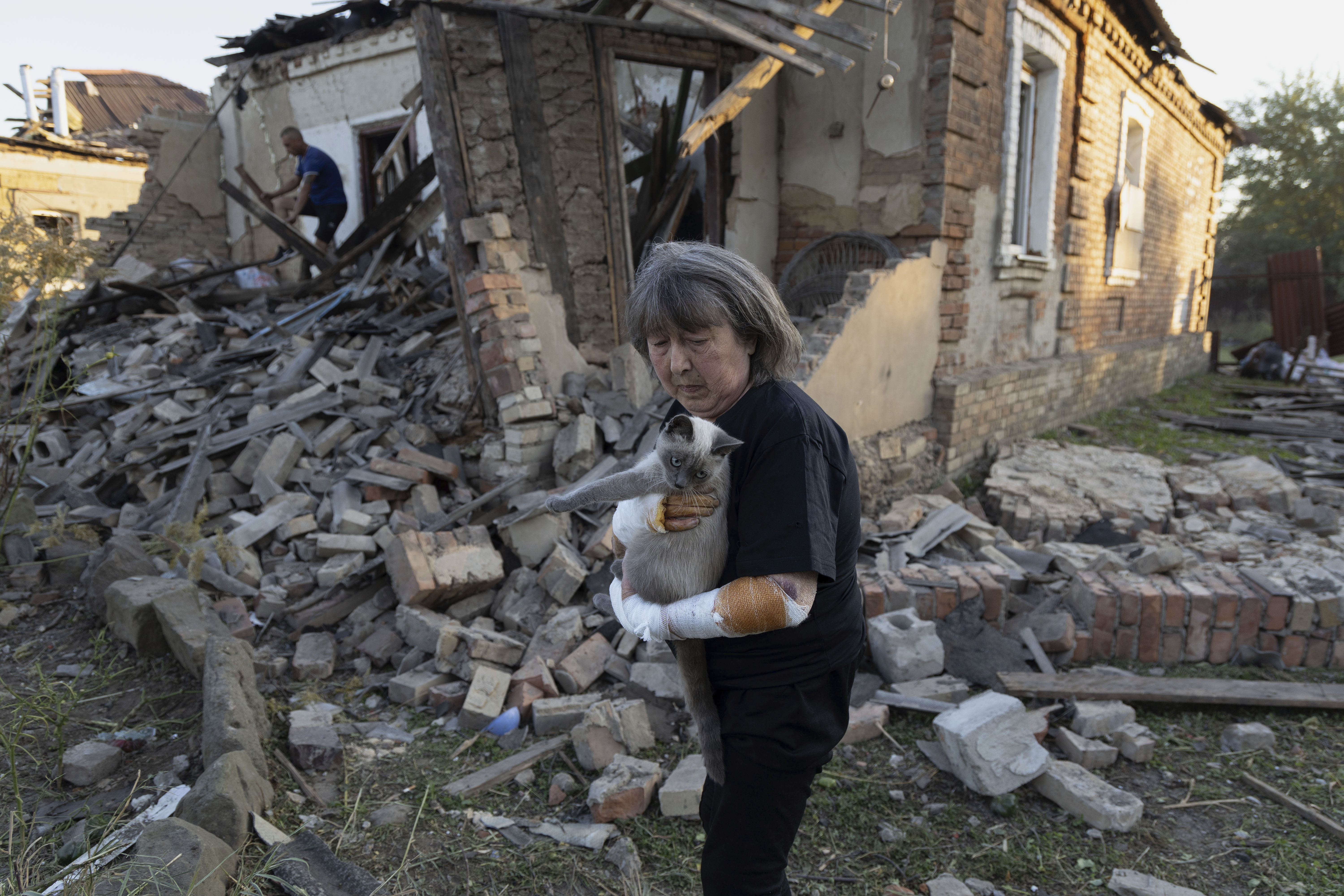 Ludmila Ivanchuk in front of her house which was damaged by a Russian rocket attack