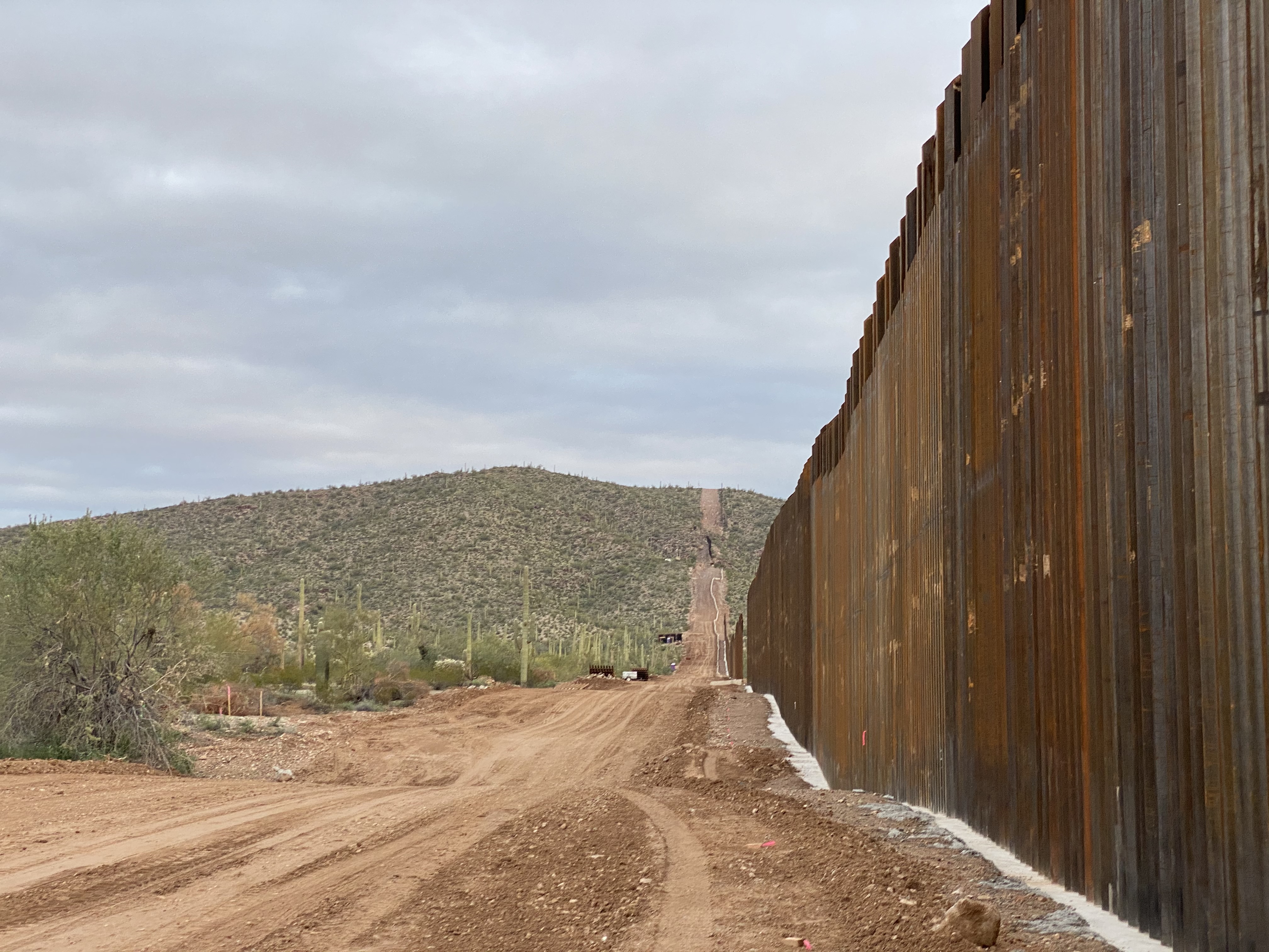 A section of border wall in the desert