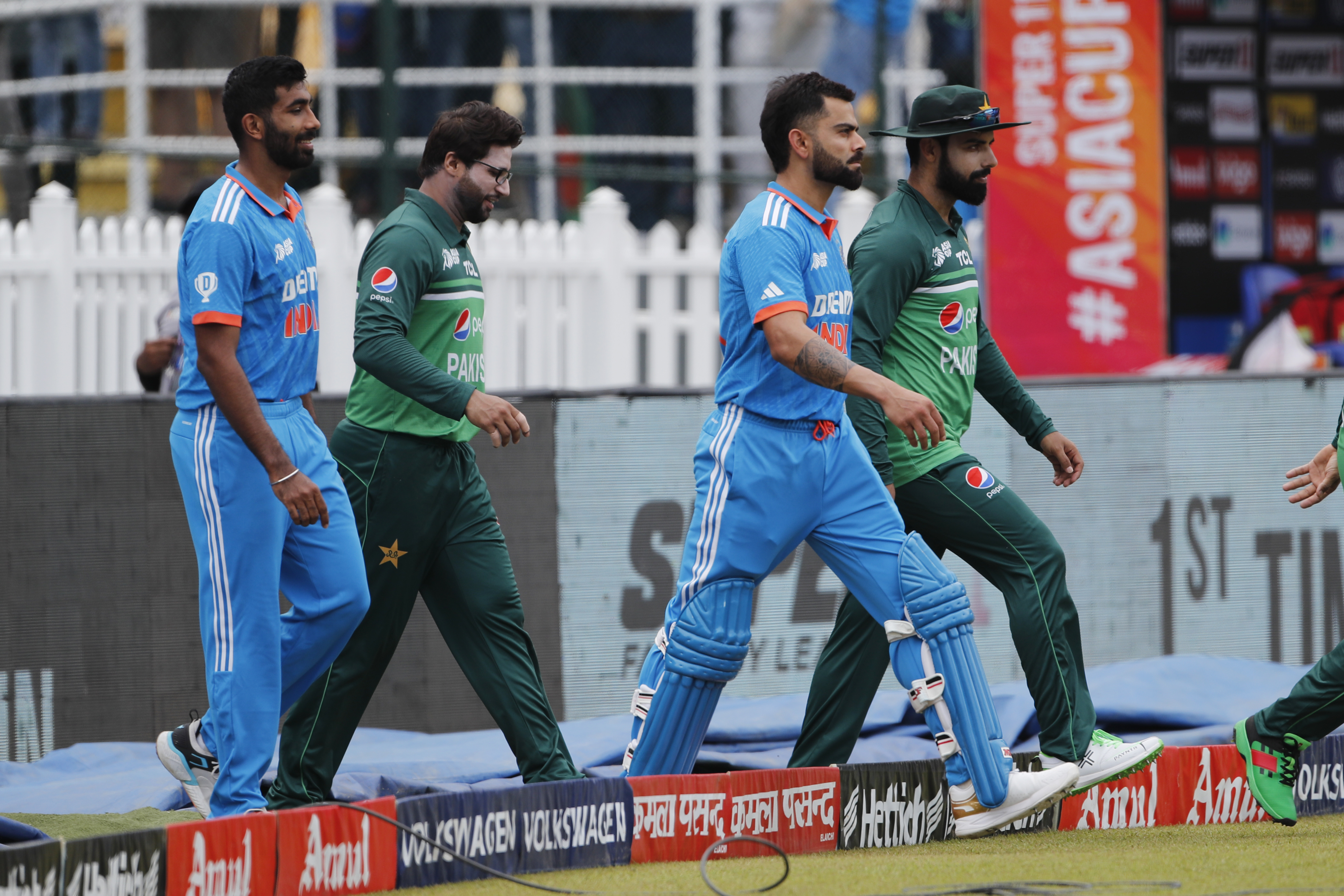 COLOMBO, SRI LANKA - SEPTEMBER 10: Shadab Khan of Pakistan (R) , Virat Kohli of India (2R) , Imam ul Haq of Pakistan (C) and Jasprit Bumrah of India (L) during the Asia Cup Super Four match between India and Pakistan at R. Premadasa Stadium on September 10, 2023 in Colombo, Sri Lanka. (Photo by Surjeet Yadav/Getty Images)
