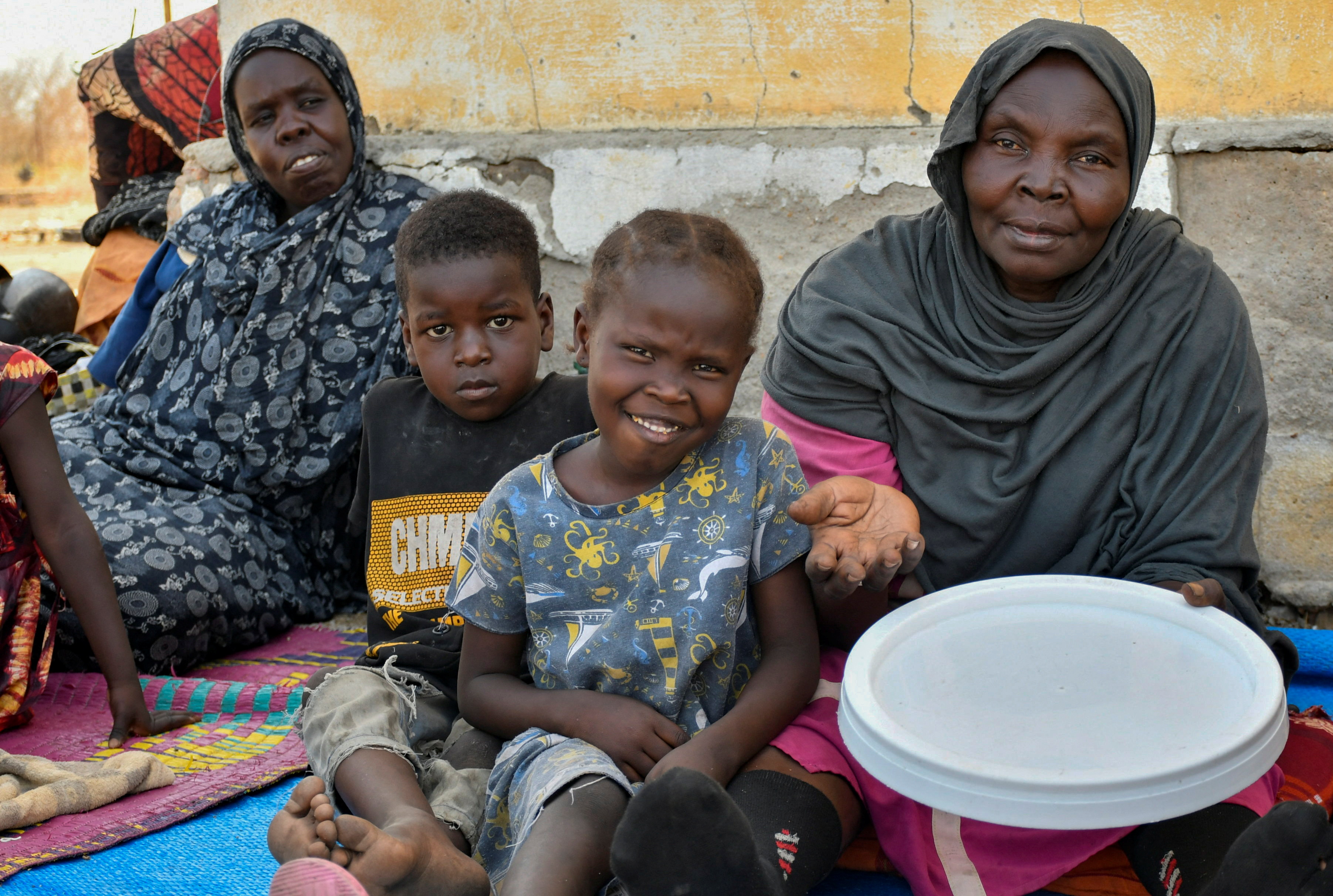Women and their children who fled the war-torn Sudan following the outbreak of fighting between the Sudanese army and the paramilitary Rapid Support Forces (RSF)
