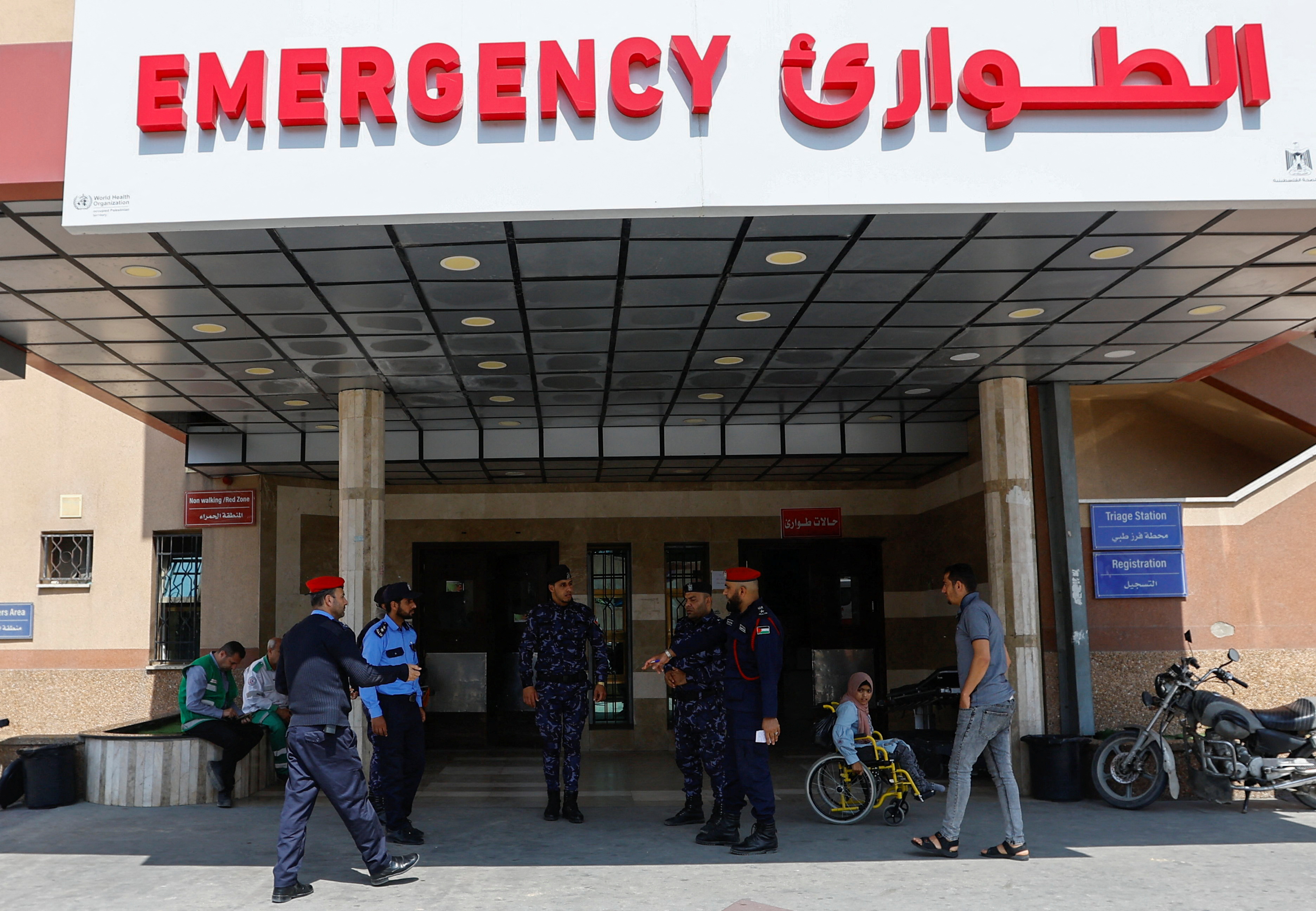 Police officers keep guard at a hospital in Gaza