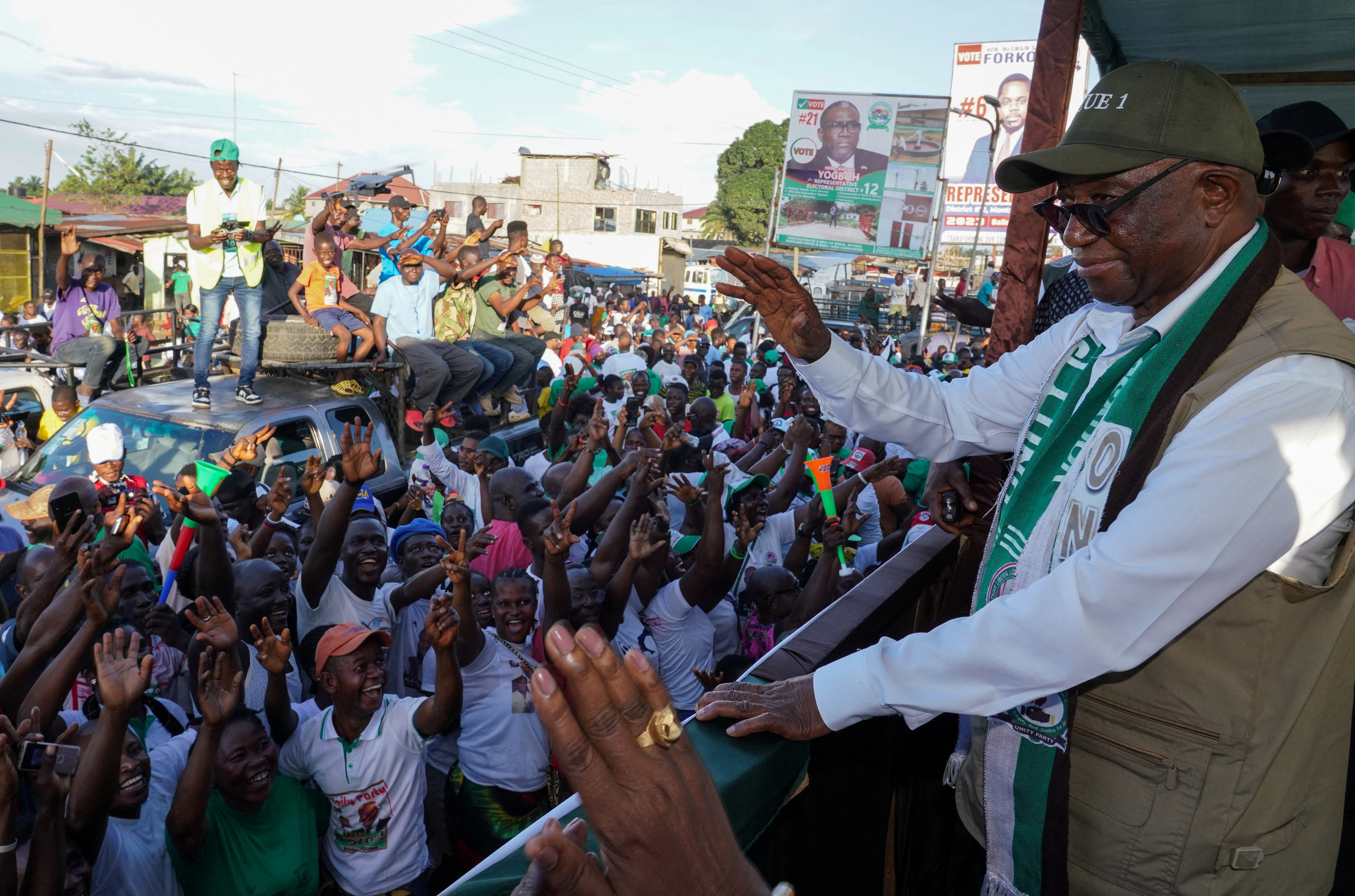 Liberia's opposition leader Joseph Boakai of Unity Party waves to his supporters as holds his final campaign rally for the presidential elections in Monrovia, Liberia