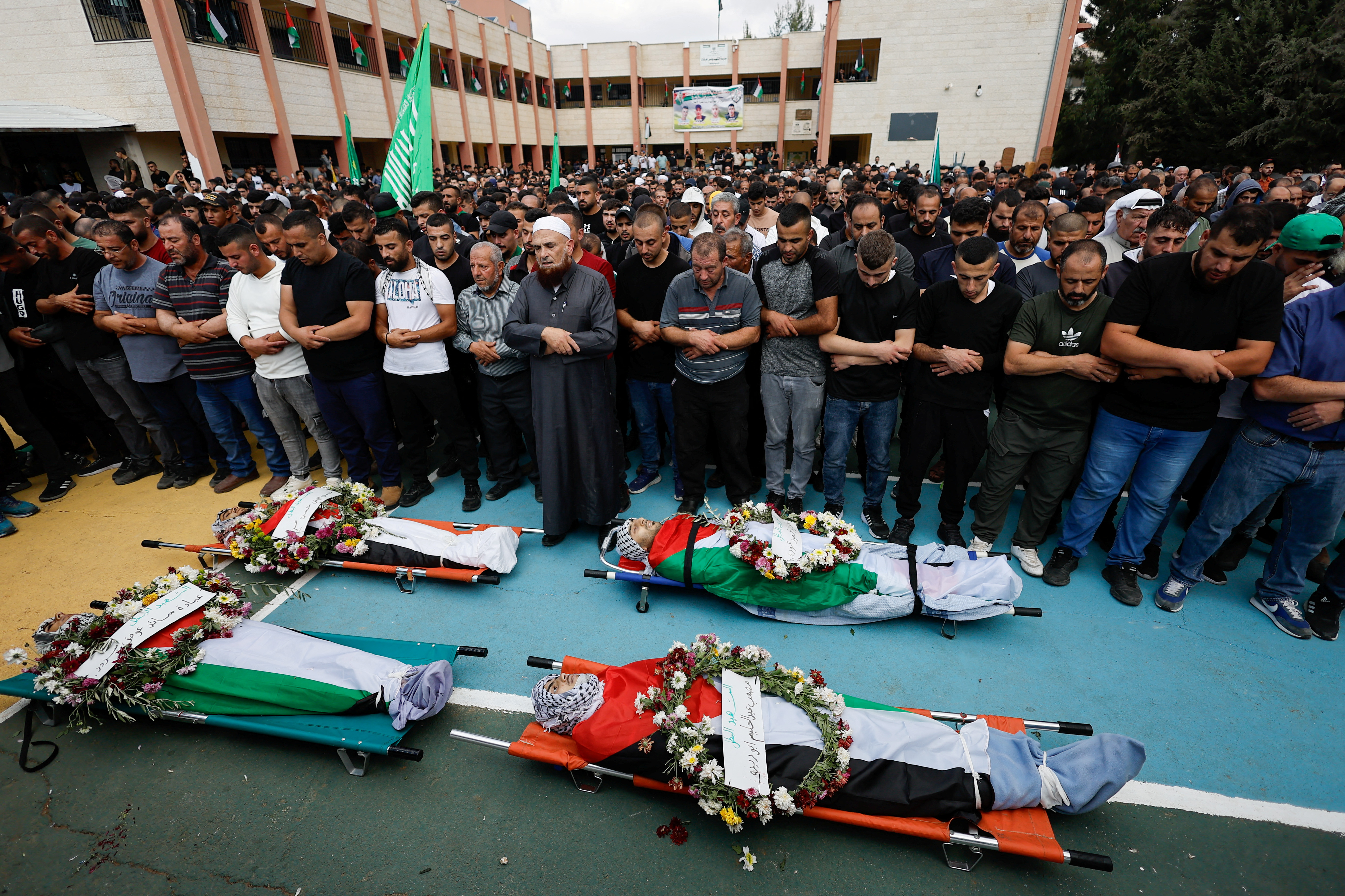 Mourners attend the funeral of four Palestinians killed in clashes with Israeli settlers, near Nablus in the Israeli-occupied West Bank October 12, 2023
