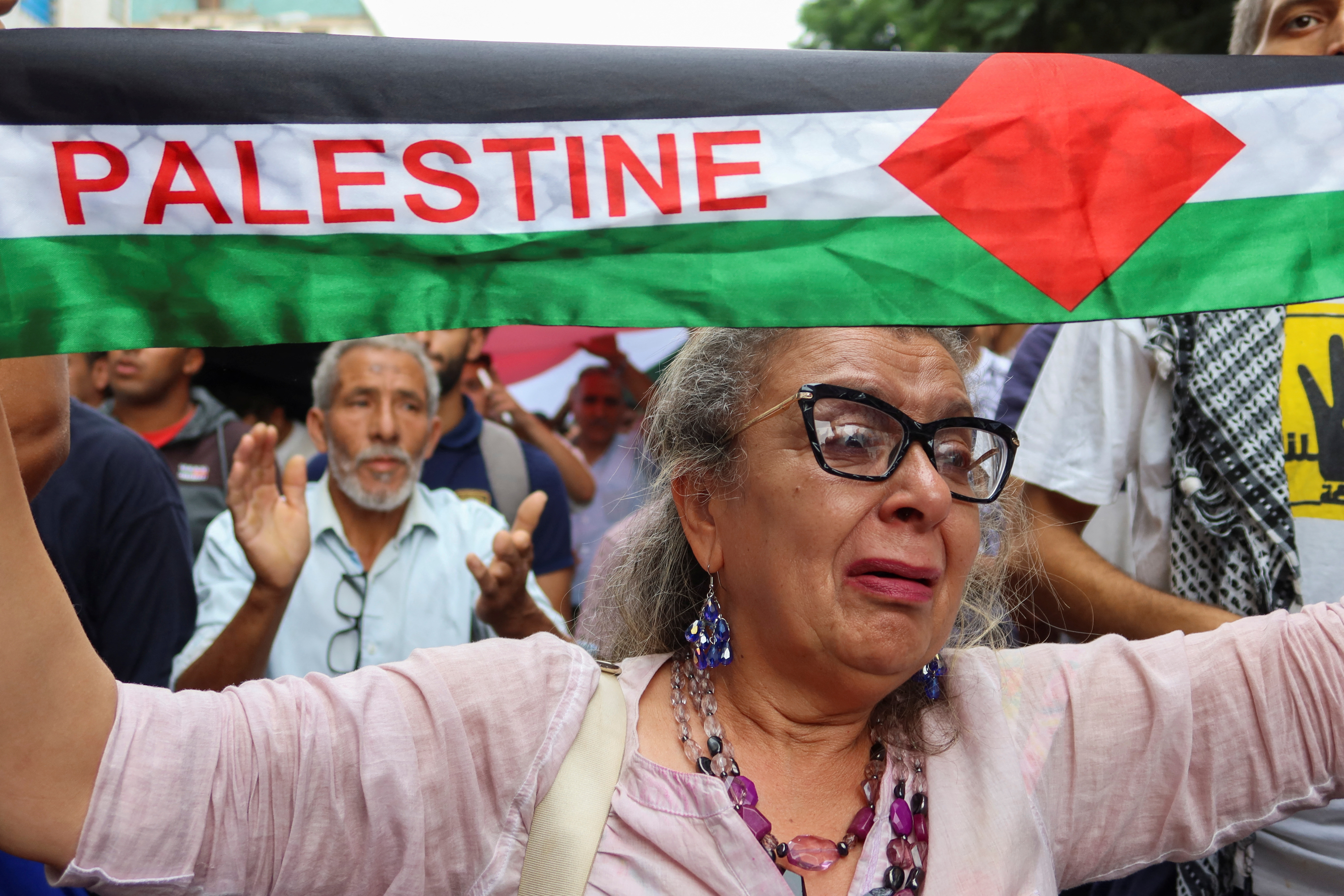 Tunisians gather during a pro-Palestinian protest to express solidarity with Palestinians in Gaza, in Tunis