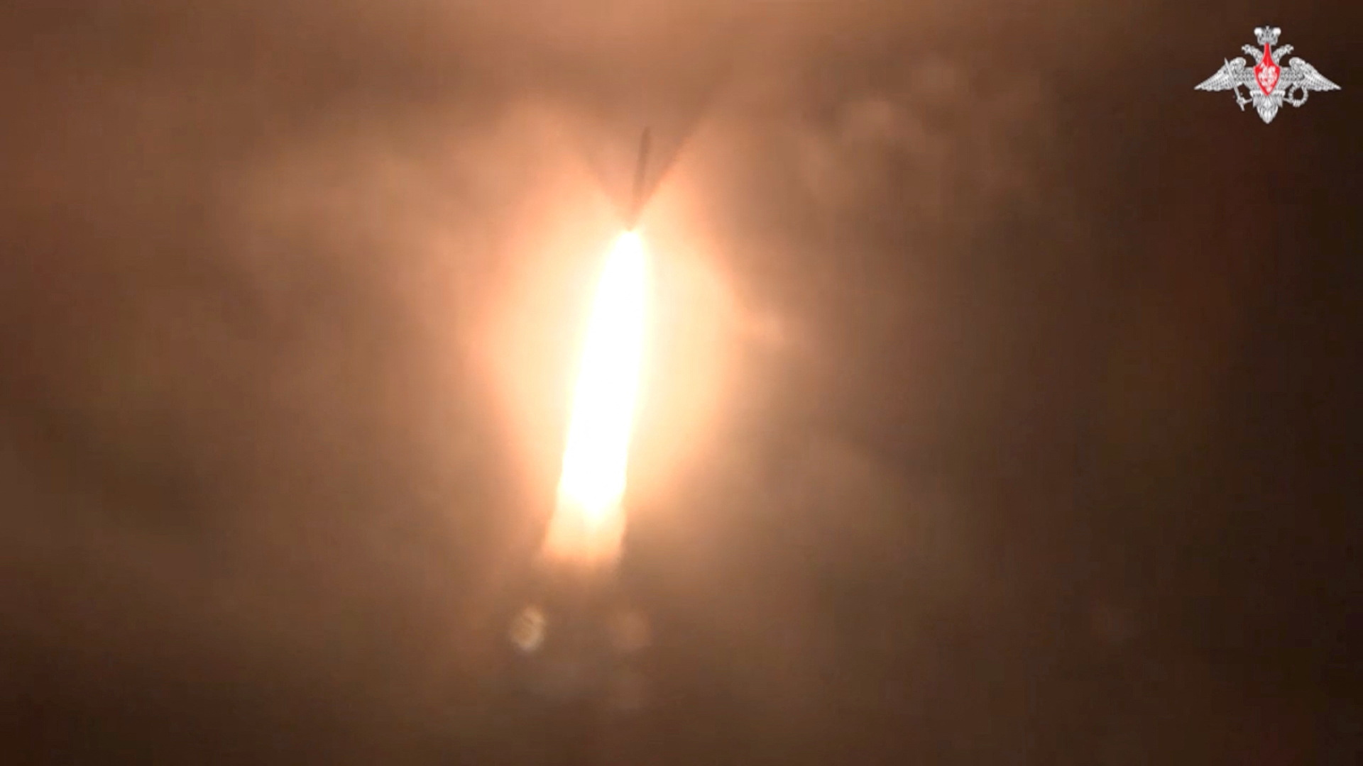 Russia's Yars intercontinental ballistic missile test-launched at the Plesetsk cosmodrome. There is lots of orange fire and smoke as the missile takes off