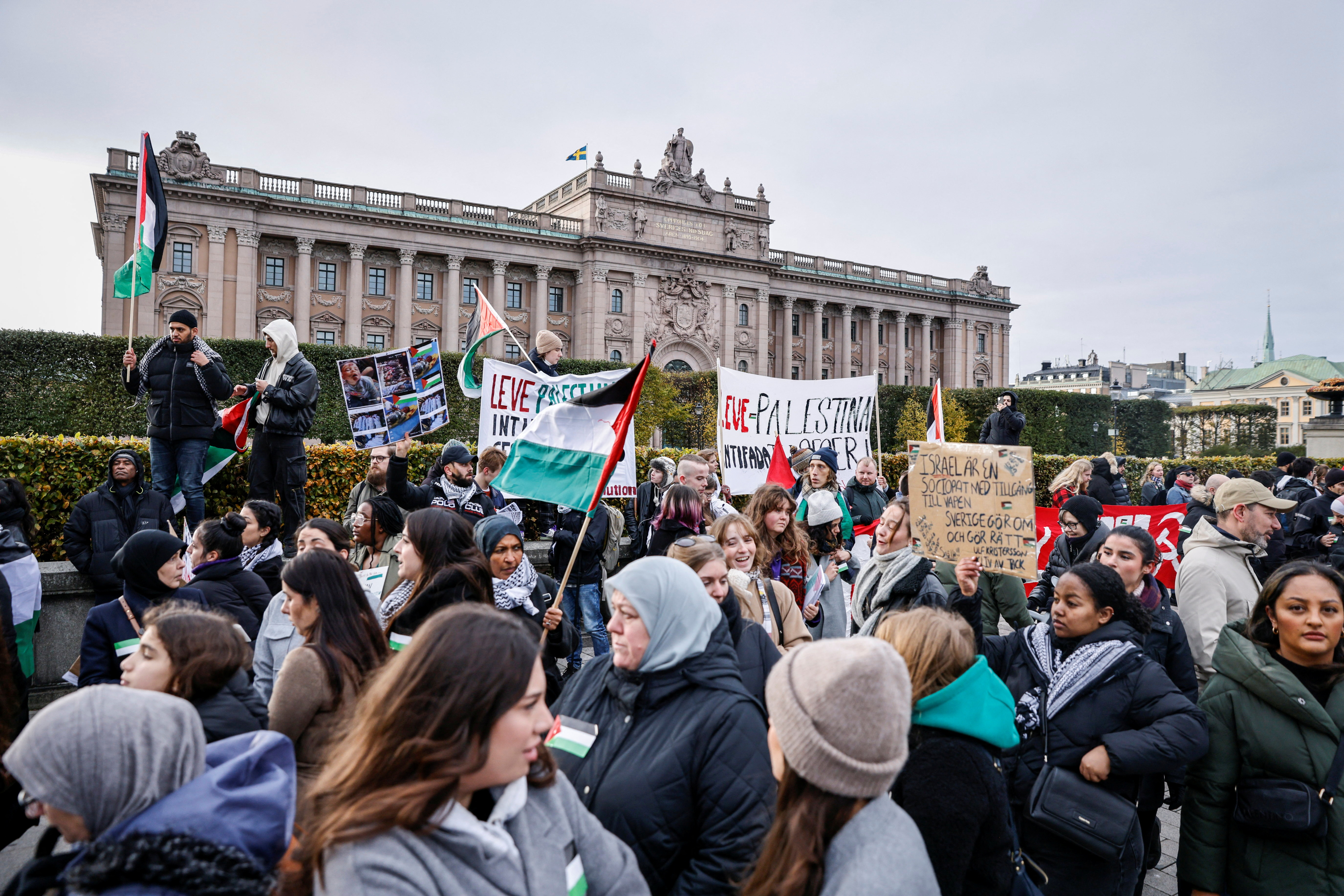 People take part in a protest in support of Palestinians in Gaza, amid the ongoing conflict between Israel and Hamas, in Stockholm, Sweden
