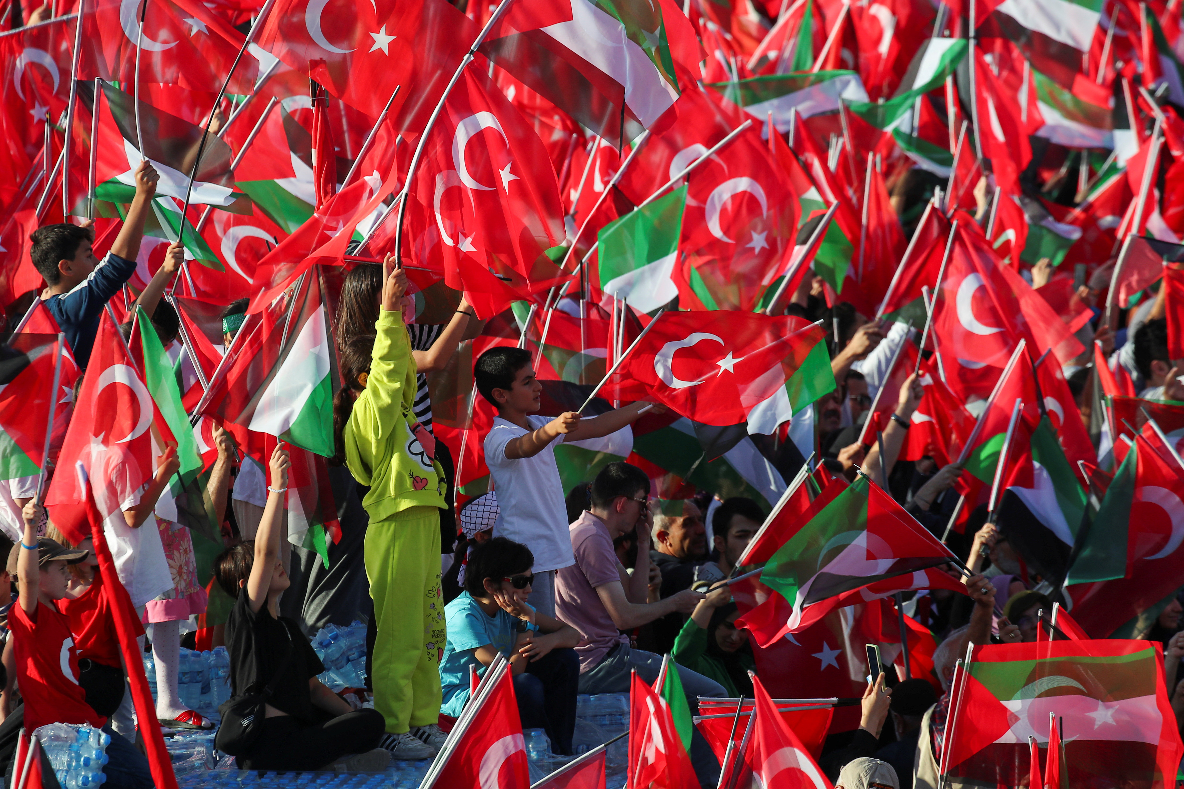 People attend a rally in solidarity with Palestinians in Gaza, amid the ongoing conflict between Israel and the Palestinian Islamist group Hamas, in Istanbul