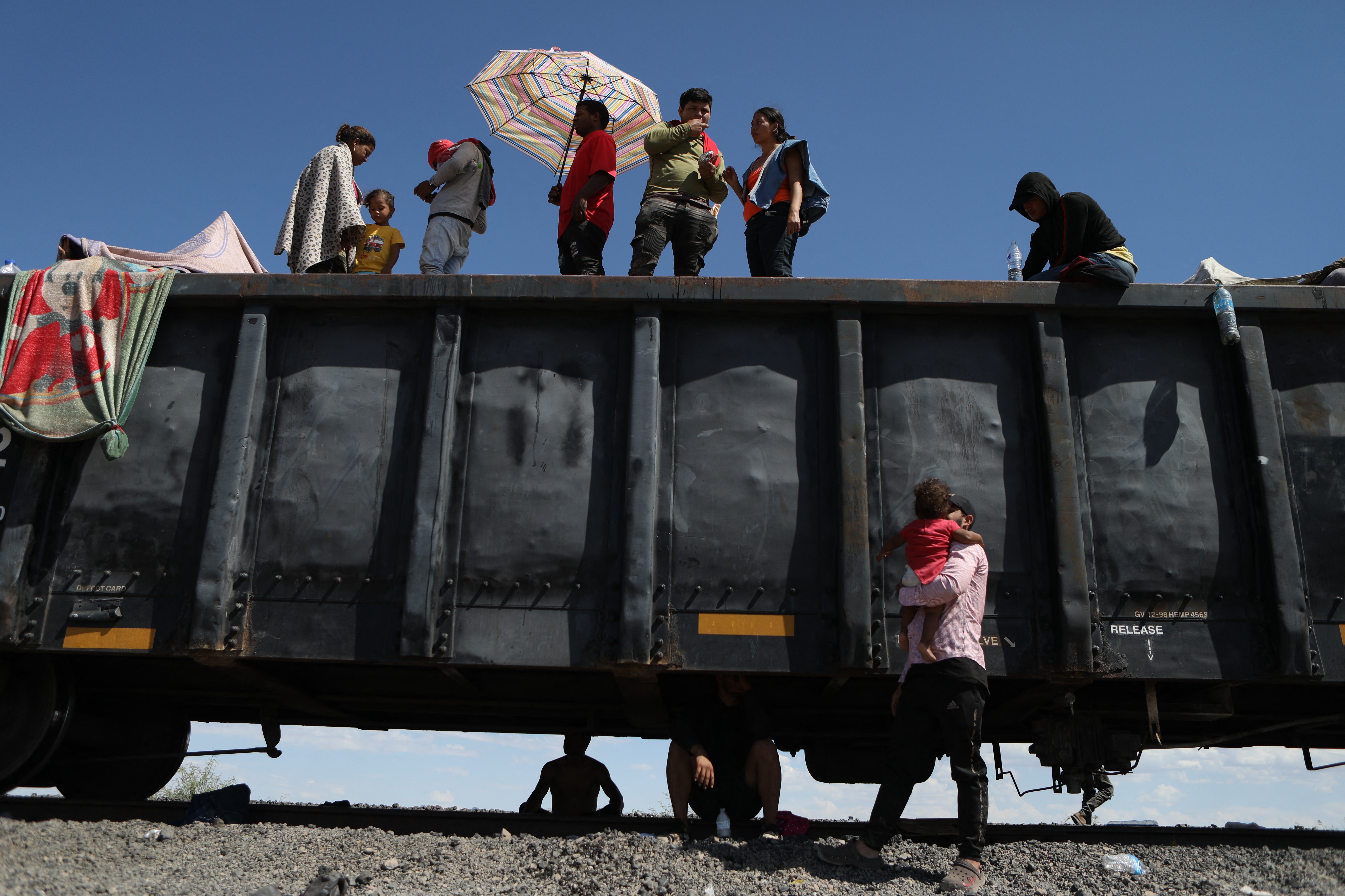 Migrant people, mostly from Venezuela, remain stranded after the goods train