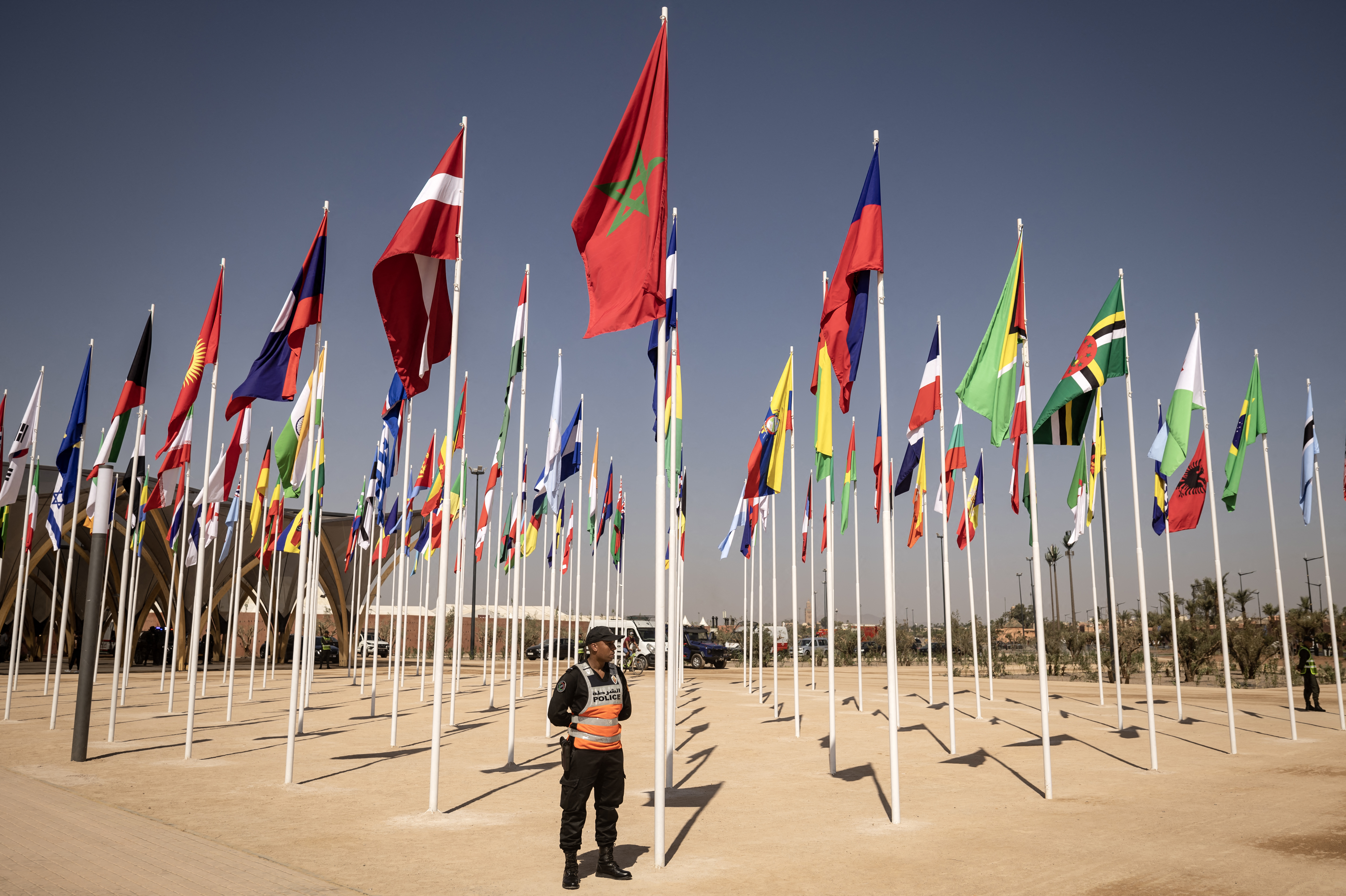 A member of security stands guard at the entrance of the venue hosting the 2023 IMF and World Bank annual meetings in Marrakesh [Fadel Senna/AFP]