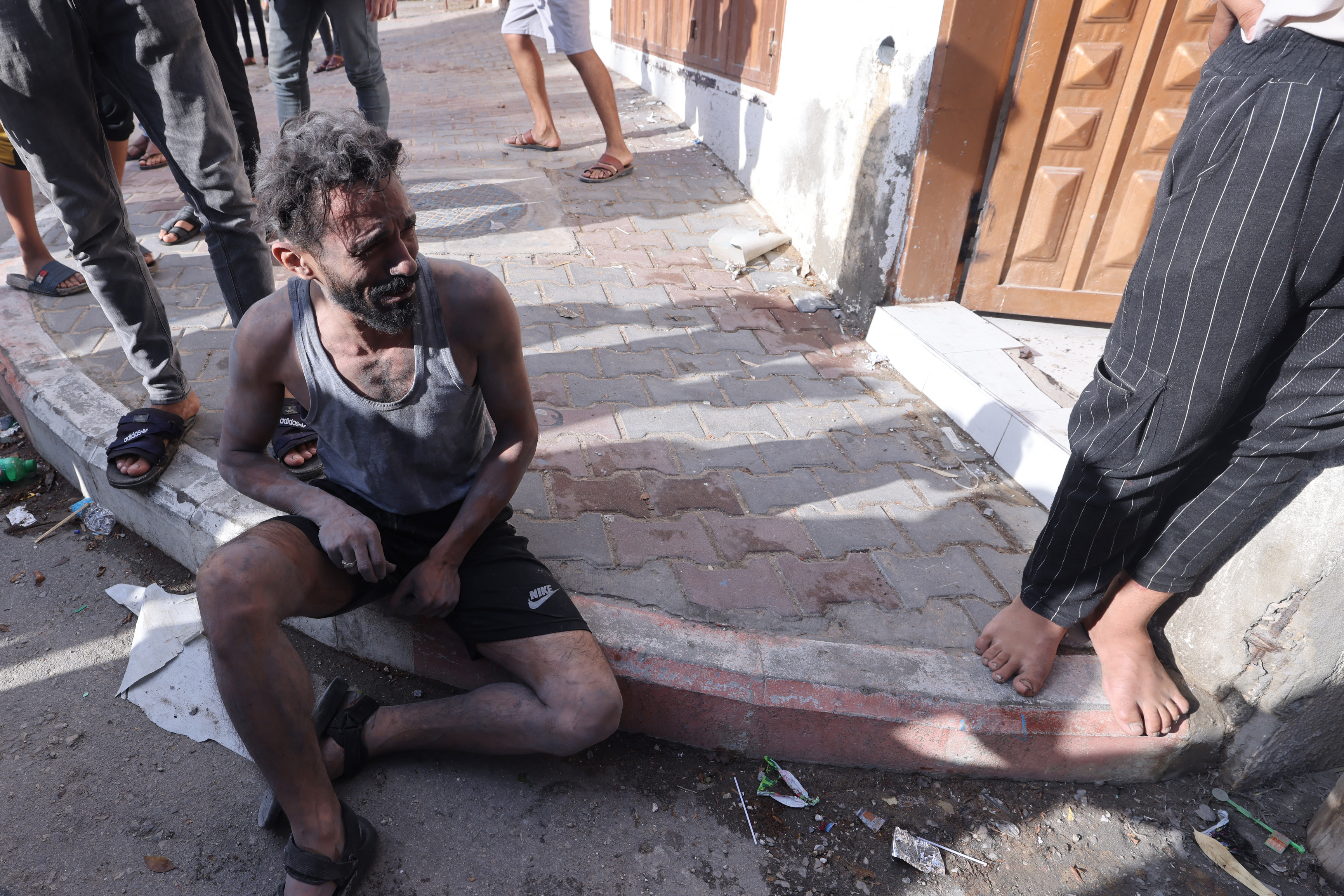 A Palestinian reacts after an Israeli airstrike at the Rafah refugee camp
