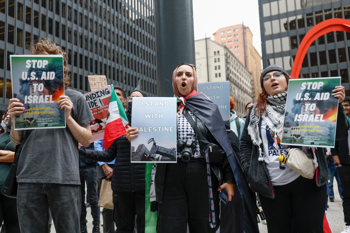 Demonstrators rally to show support for the Palestinian people following the Gaza City hospital blast