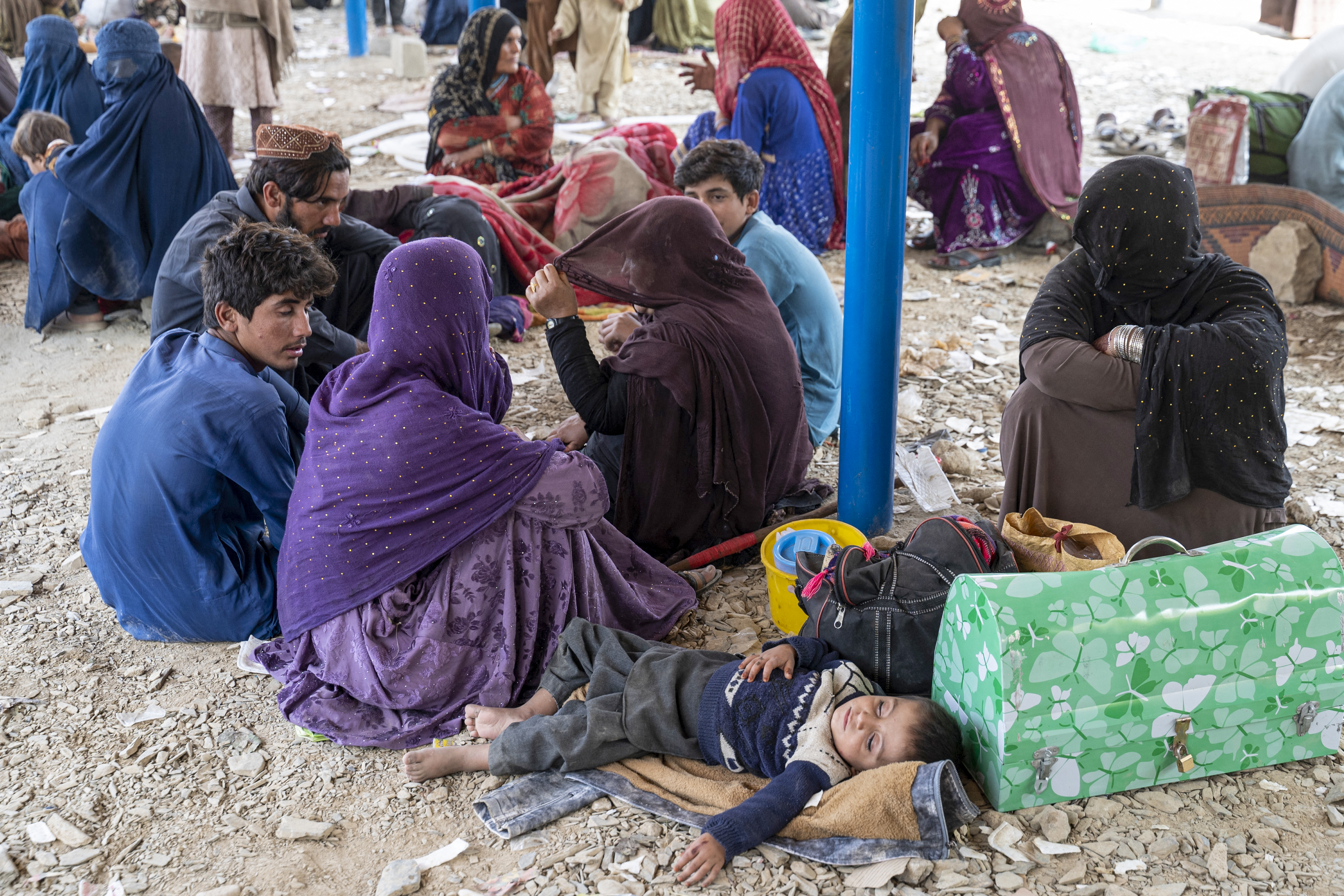 Afghan refugees arrive in trucks from Pakistan at the Afghanistan-Pakistan Torkham border in Nangarhar province