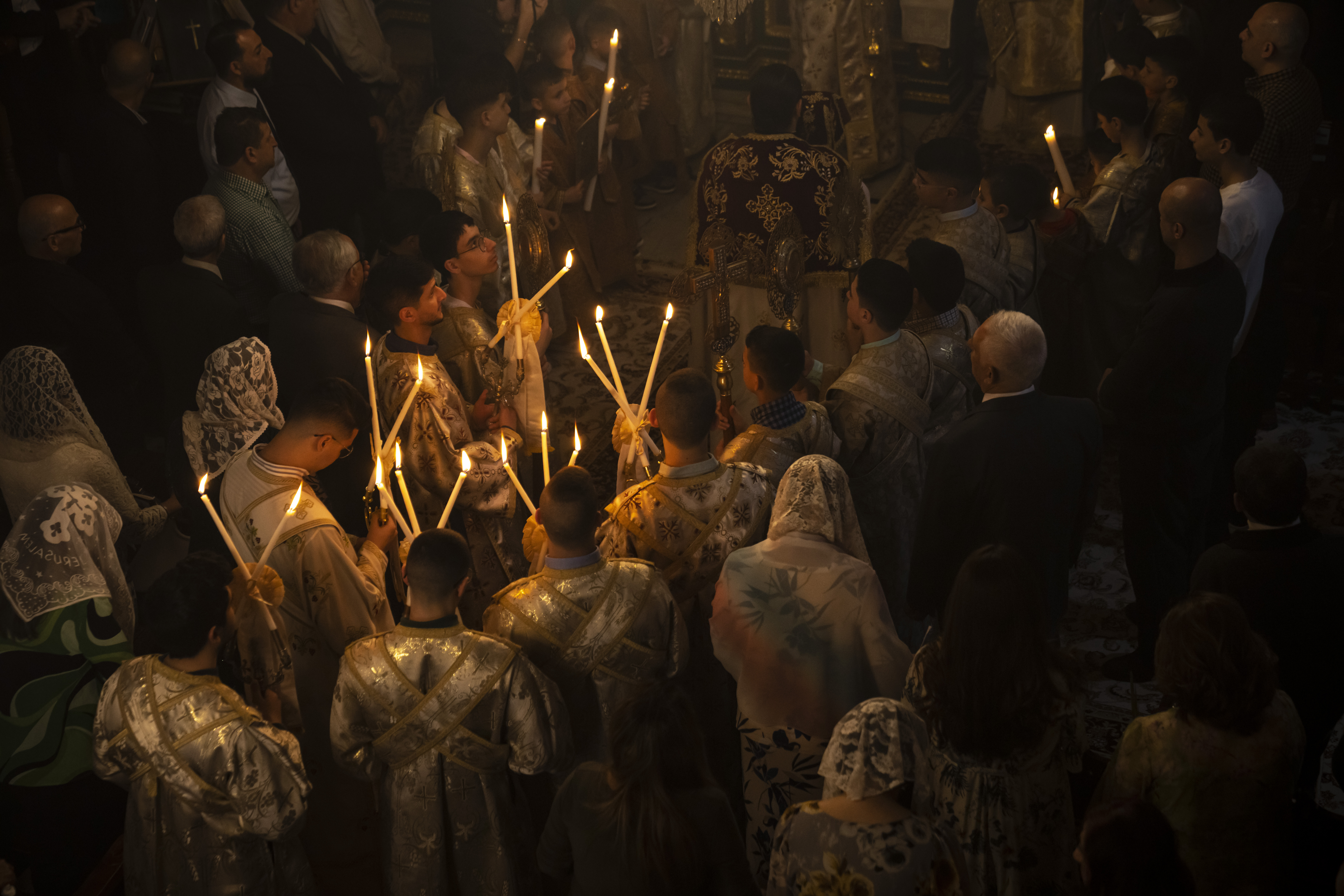 Palestinian Christians attend Palm Sunday mass in a Greek Orthodox church in Gaza City
