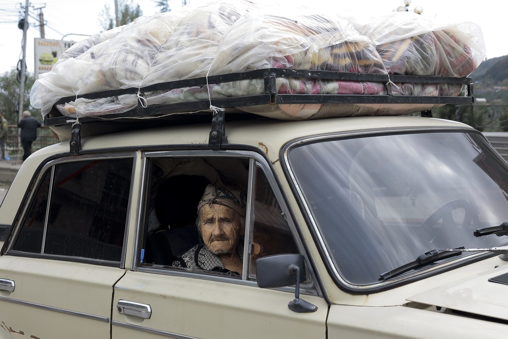 An ethnic Armenian woman sits in a car