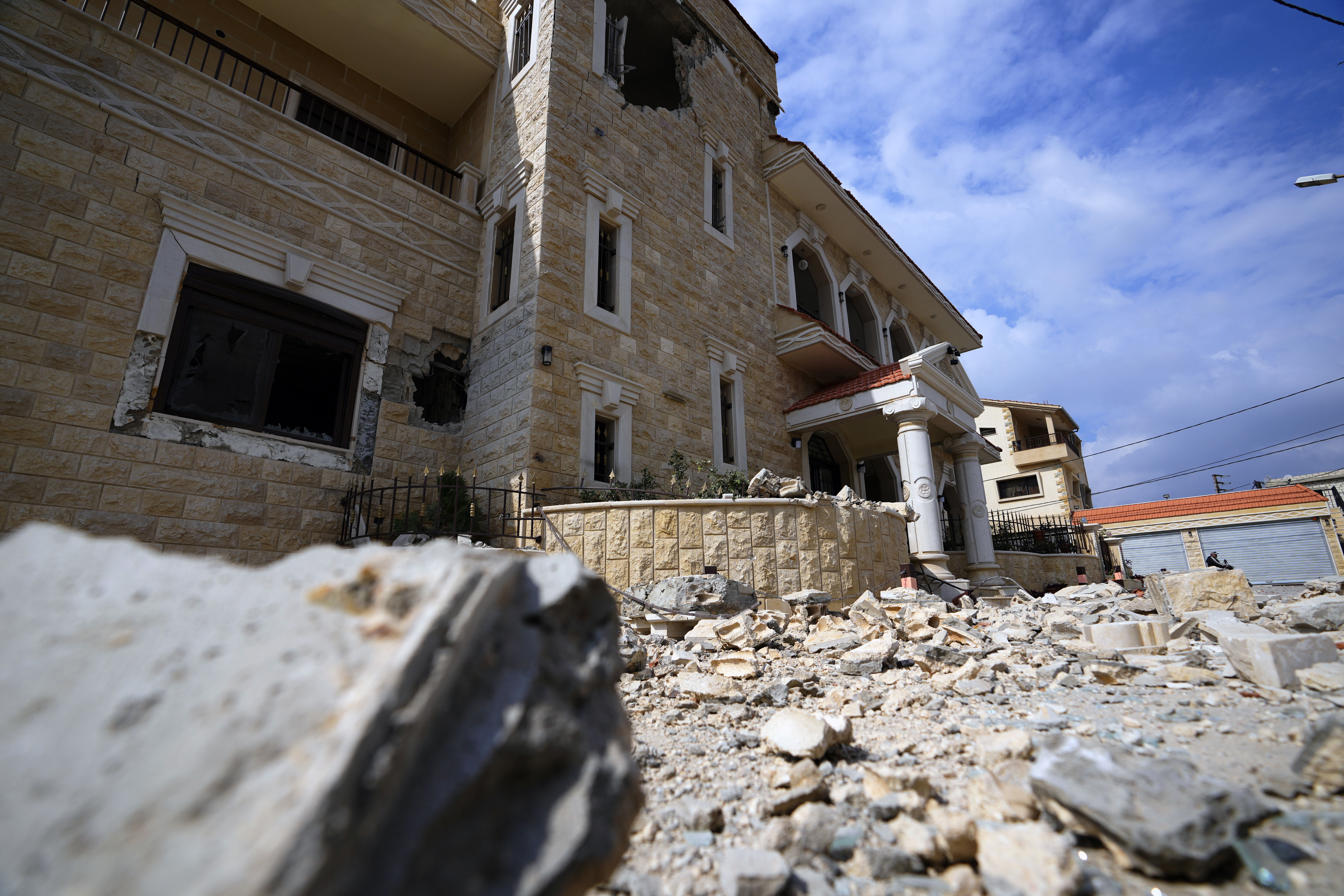 Debris of a damaged house that was hit by Israeli shelling is seen in the village of Duhaira near the border with Israel, south Lebanon, Wednesday, Oct. 11, 2023. Lebanon's state-run National News Agency says Israeli shelling of a southern Lebanese villages has wounded three civilians and caused damage to about 10 homes. (AP Photo/Hassan Ammar)