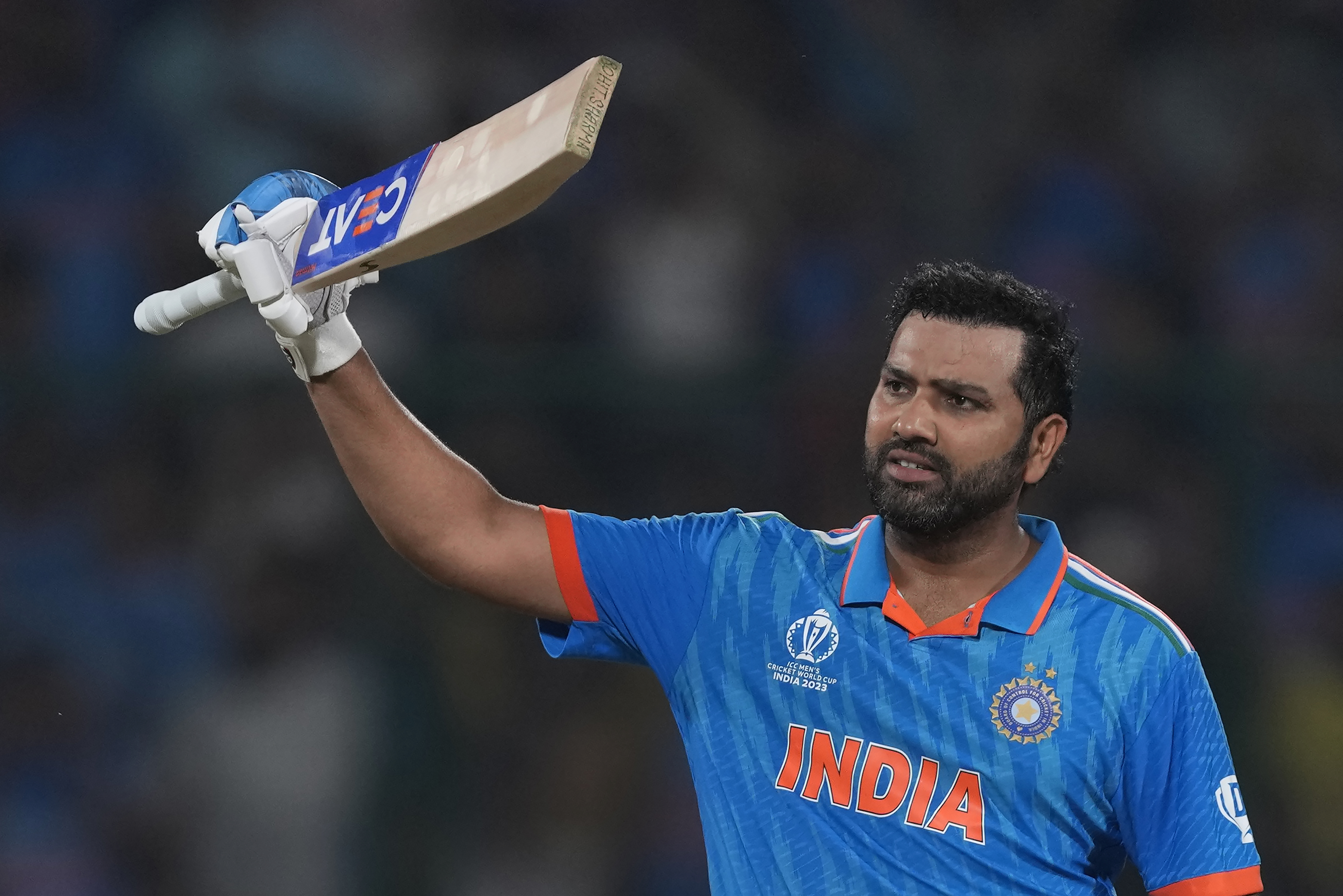 India's captain Rohit Sharma celebrates his century