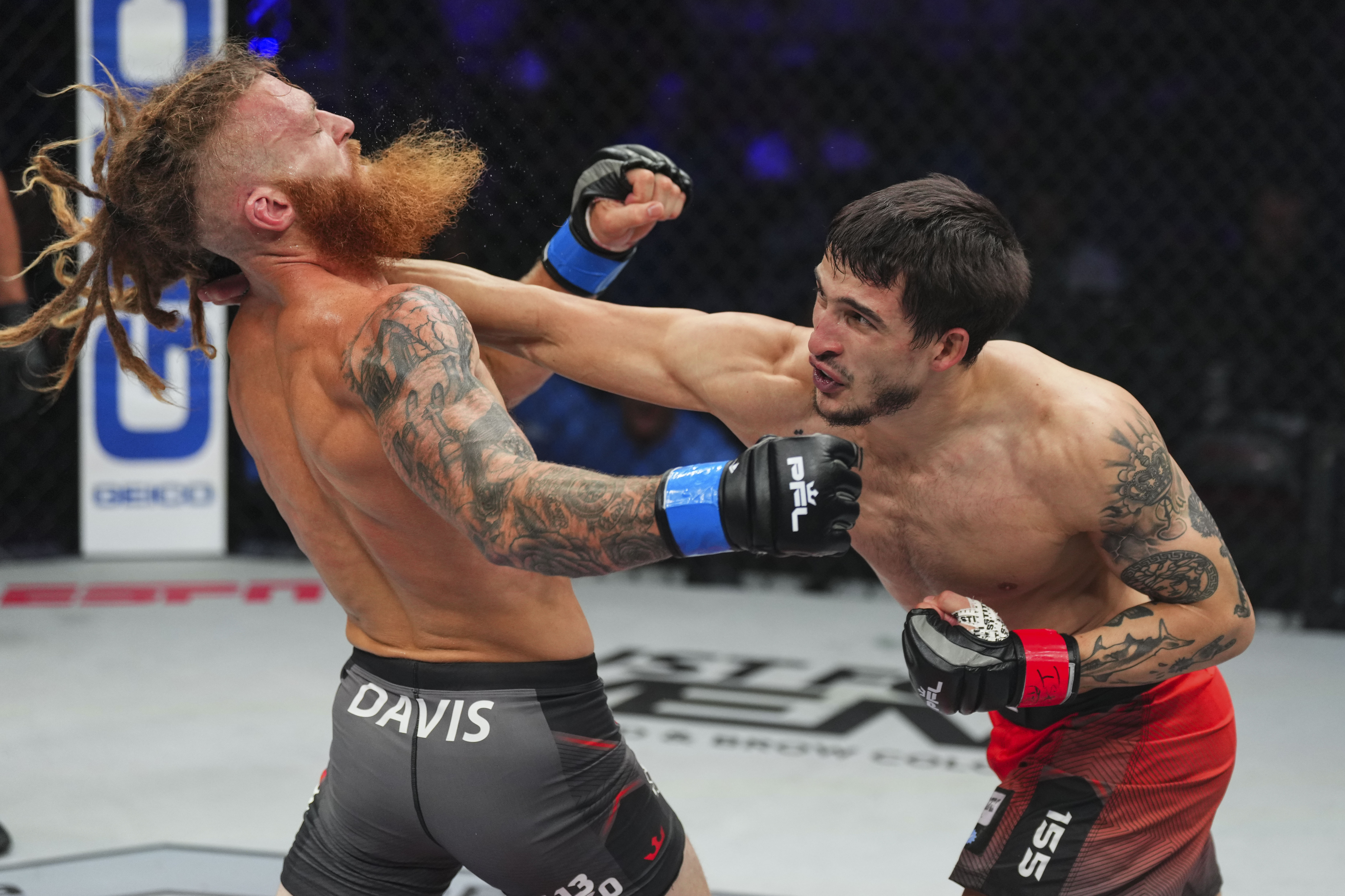 Biaggio Ali Walsh snaps Ed Davis' head back with a right cross punch