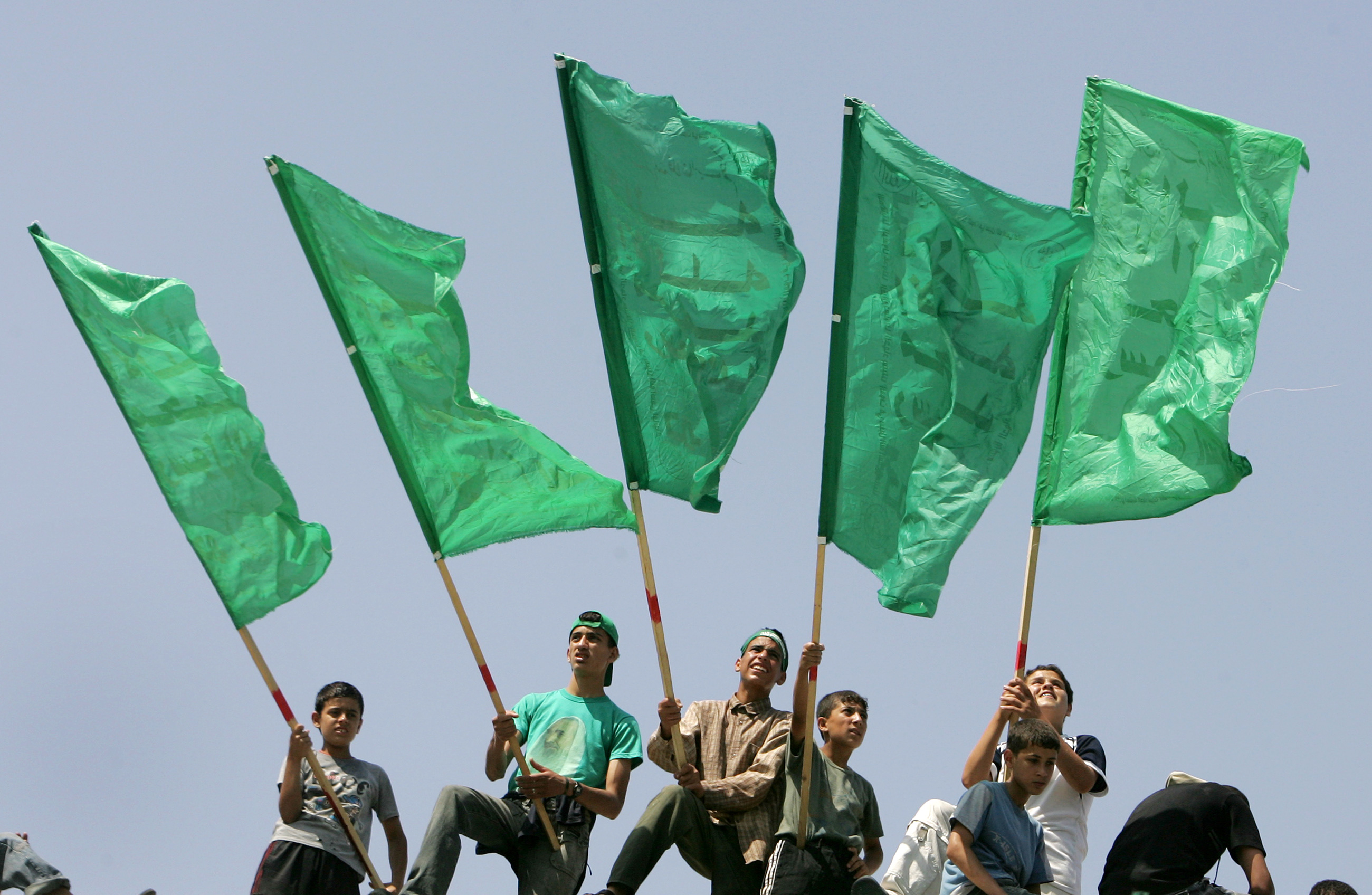 Palestinians wave Hamas flags during a celebration rally in Gaza June 15, 2007