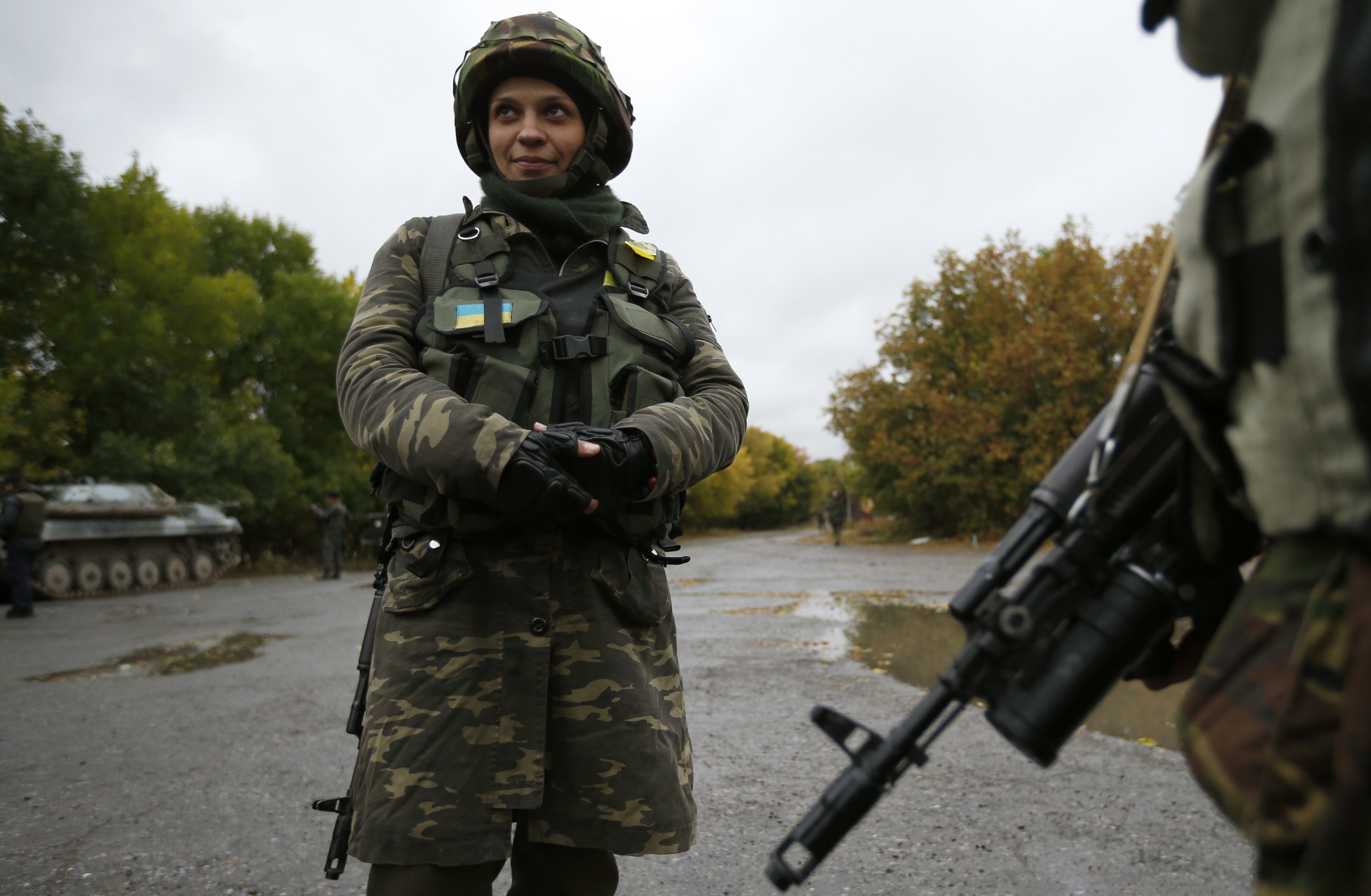 Ukrainian servicewoman Nadie, 36, stands at the military camp in the village of Luhanske, eastern Ukraine September 24, 2014