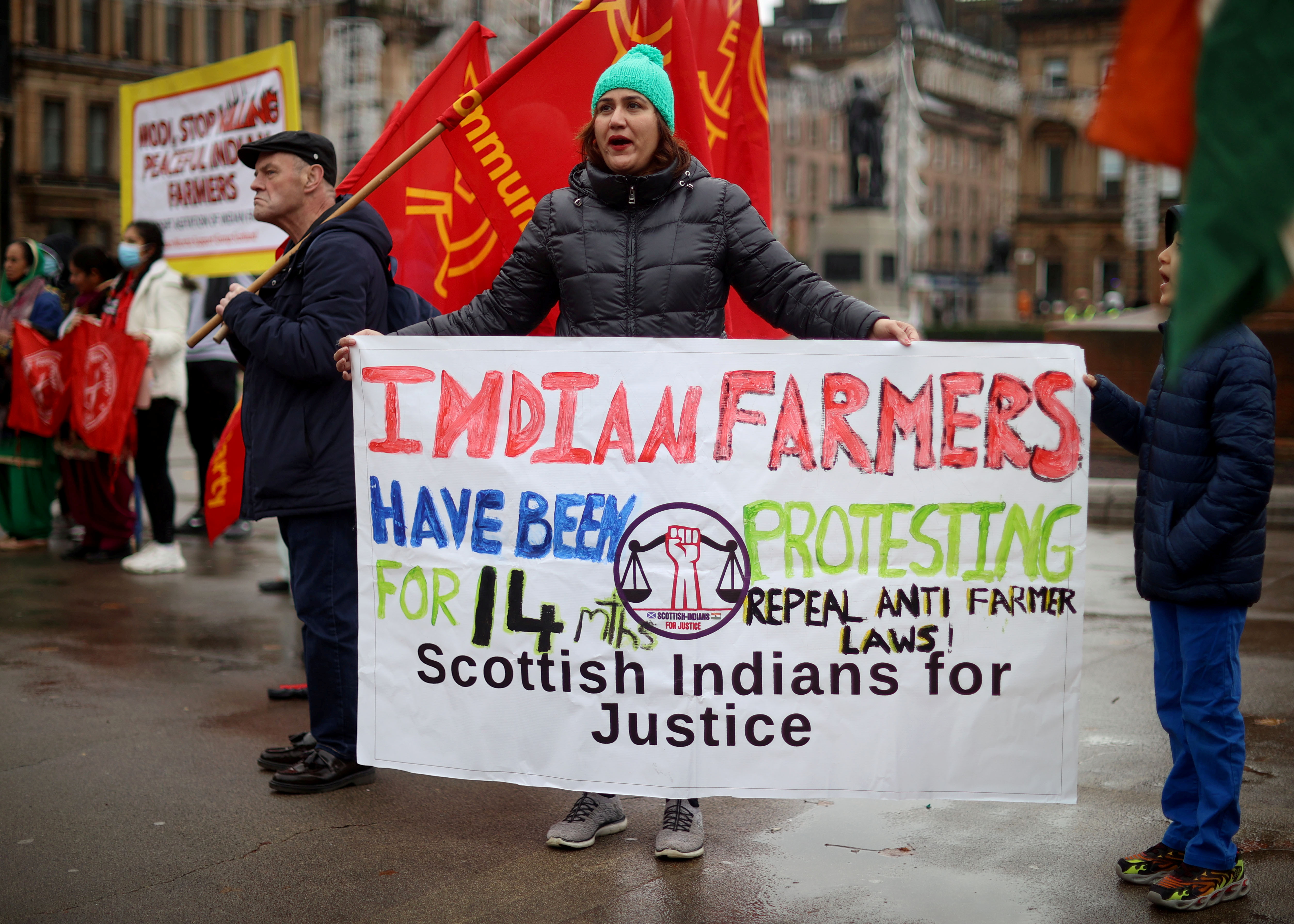 Demonstrators hold placards during a protest against the visit of India's Prime Minister Narendra Modi to the UN Climate Change Conference (COP26) in Glasgow, Scotland, Britain, October 31, 2021.