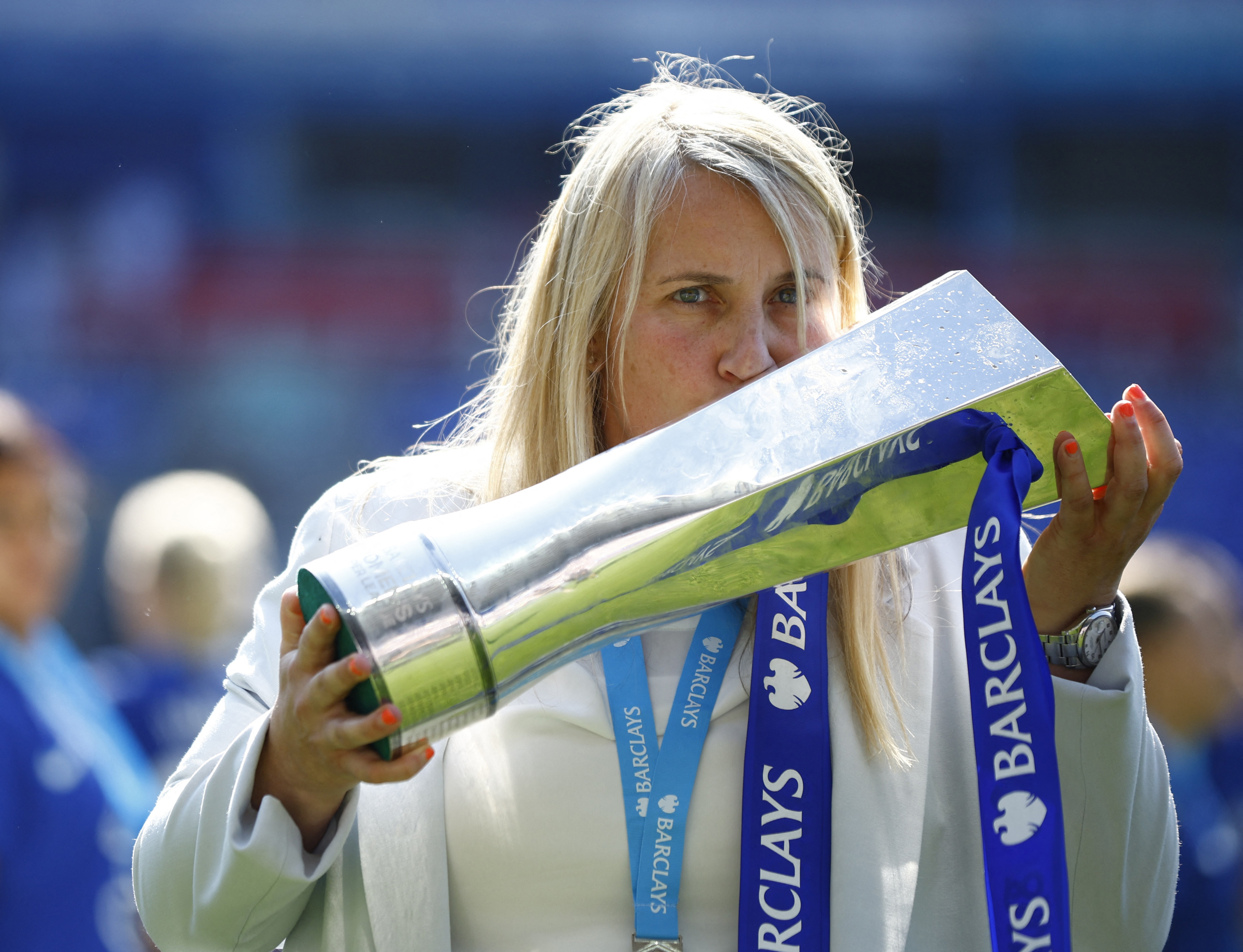 Chelsea manager Emma Hayes holds and kisses the Women's Super League trophy
