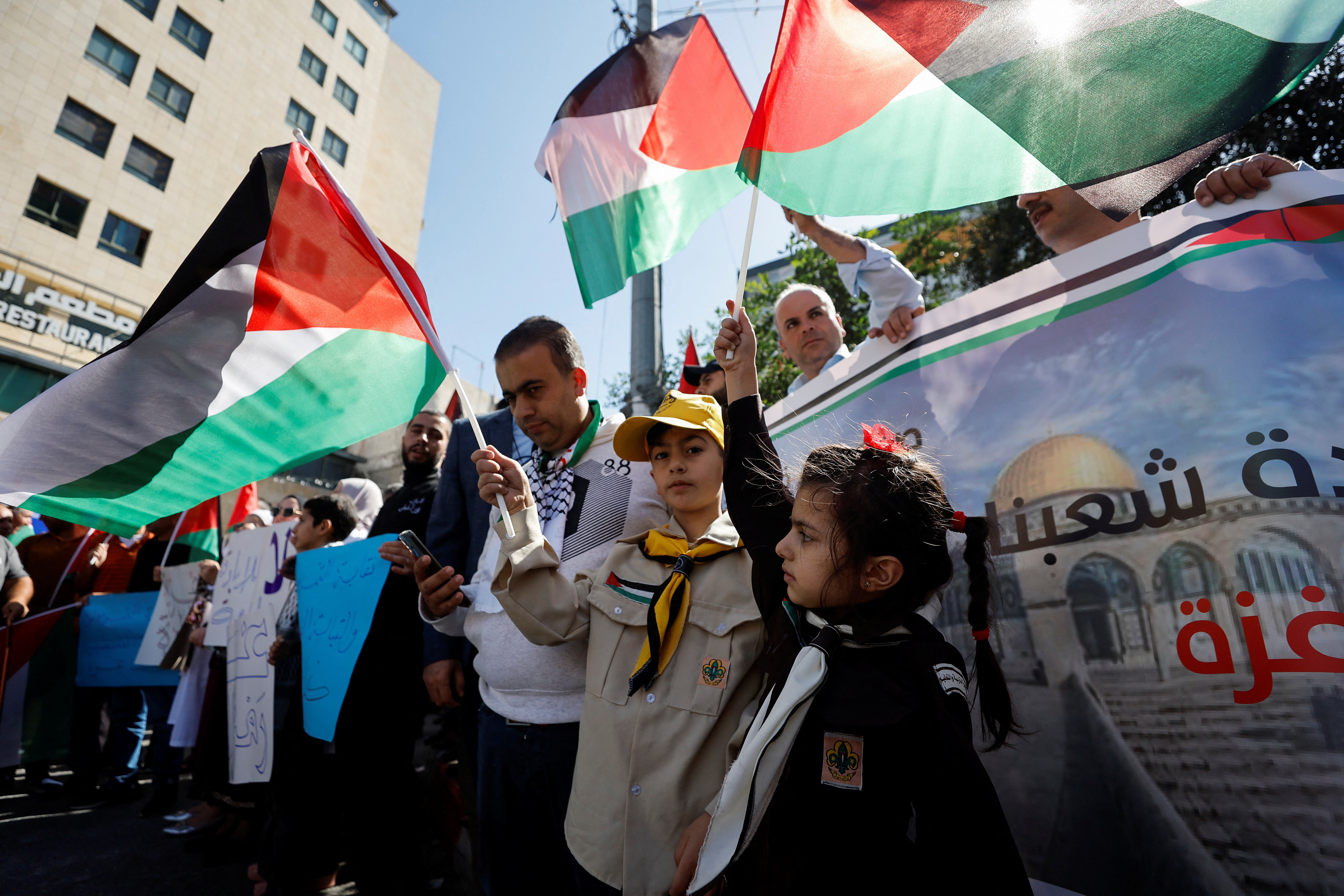 Palestinians take part in a protest in support of the people of Gaza, as the conflict between Israel and Palestinian Islamist group Hamas continues, in Hebron, in the Israeli-occupied West Bank, October 25, 2023