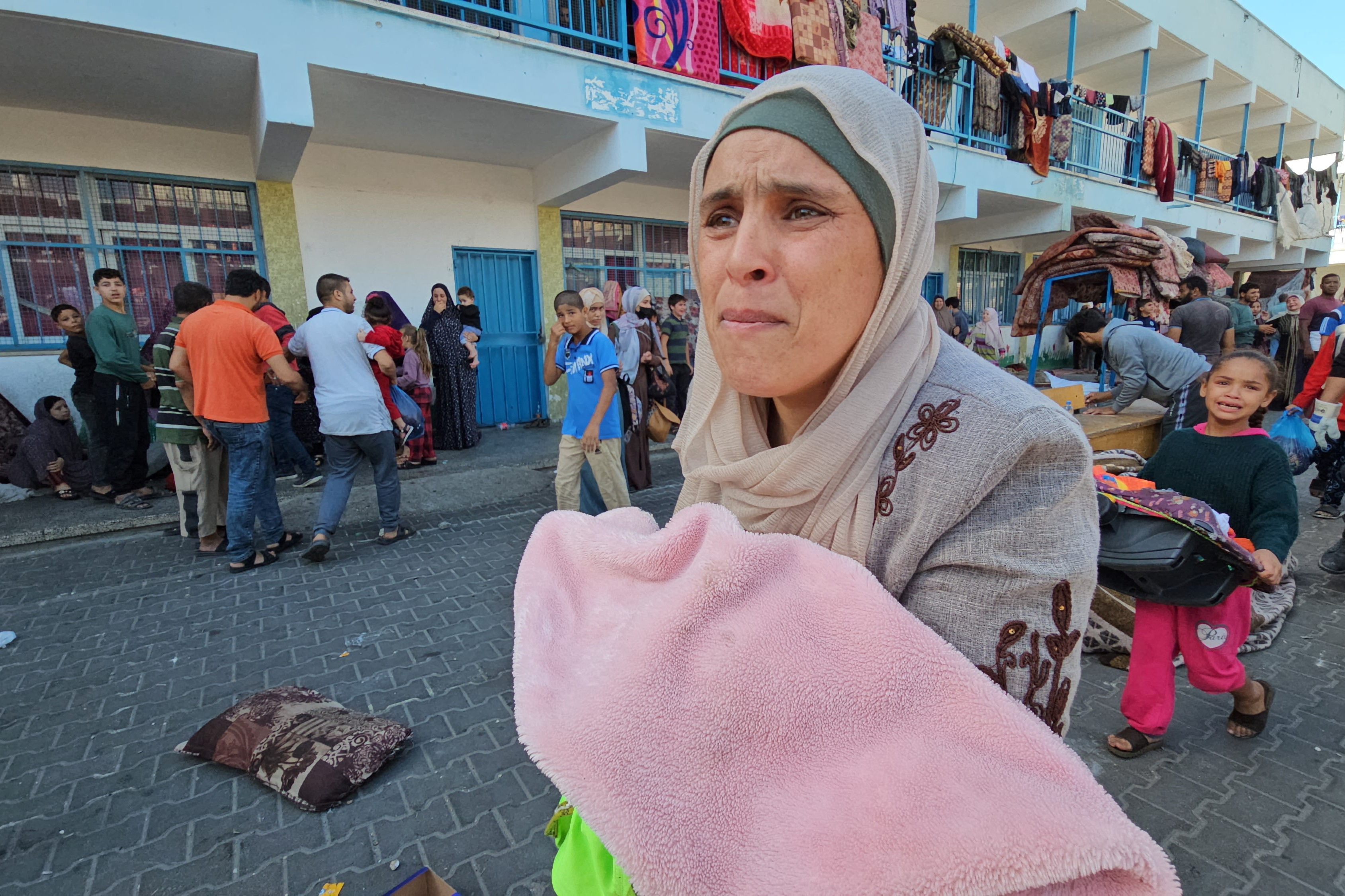 Palestinians react following a strike at a UN-run school sheltering displaced people, amid the ongoing conflict between Israel and Palestinian Islamist group Hamas, in the Jabalia refugee camp in the northern Gaza Strip