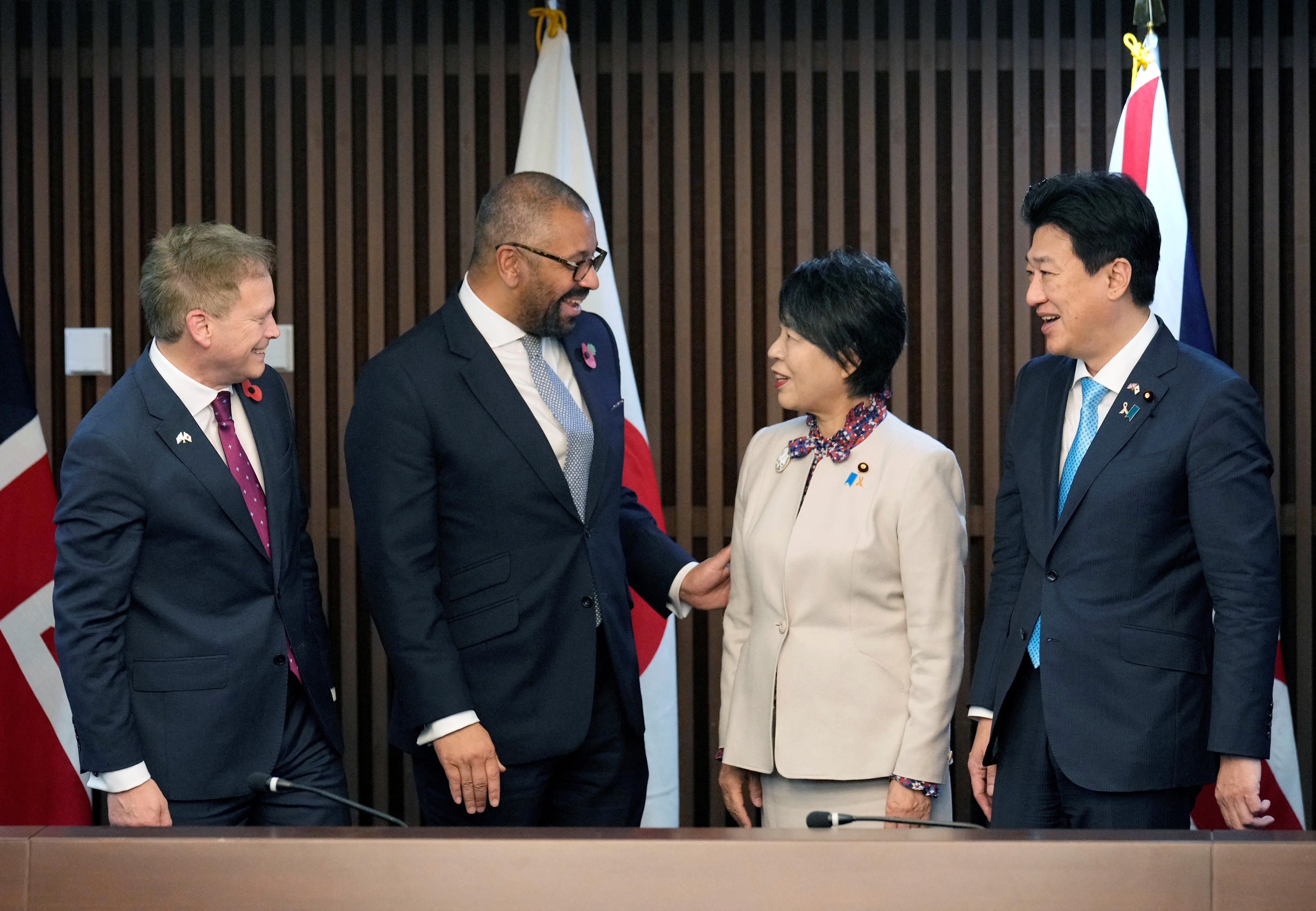 British Secretary of State for Defence Grant Shapps and Foreign Secretary James Cleverly react after a photo session with Japan's Foreign Minister Yoko Kamikawa and Defence Minister Minoru Kihara prior to their meeting at the Foreign Ministry in Tokyo, Japan, 07 November 2023. FRANCK ROBICHON/Pool via REUTERS