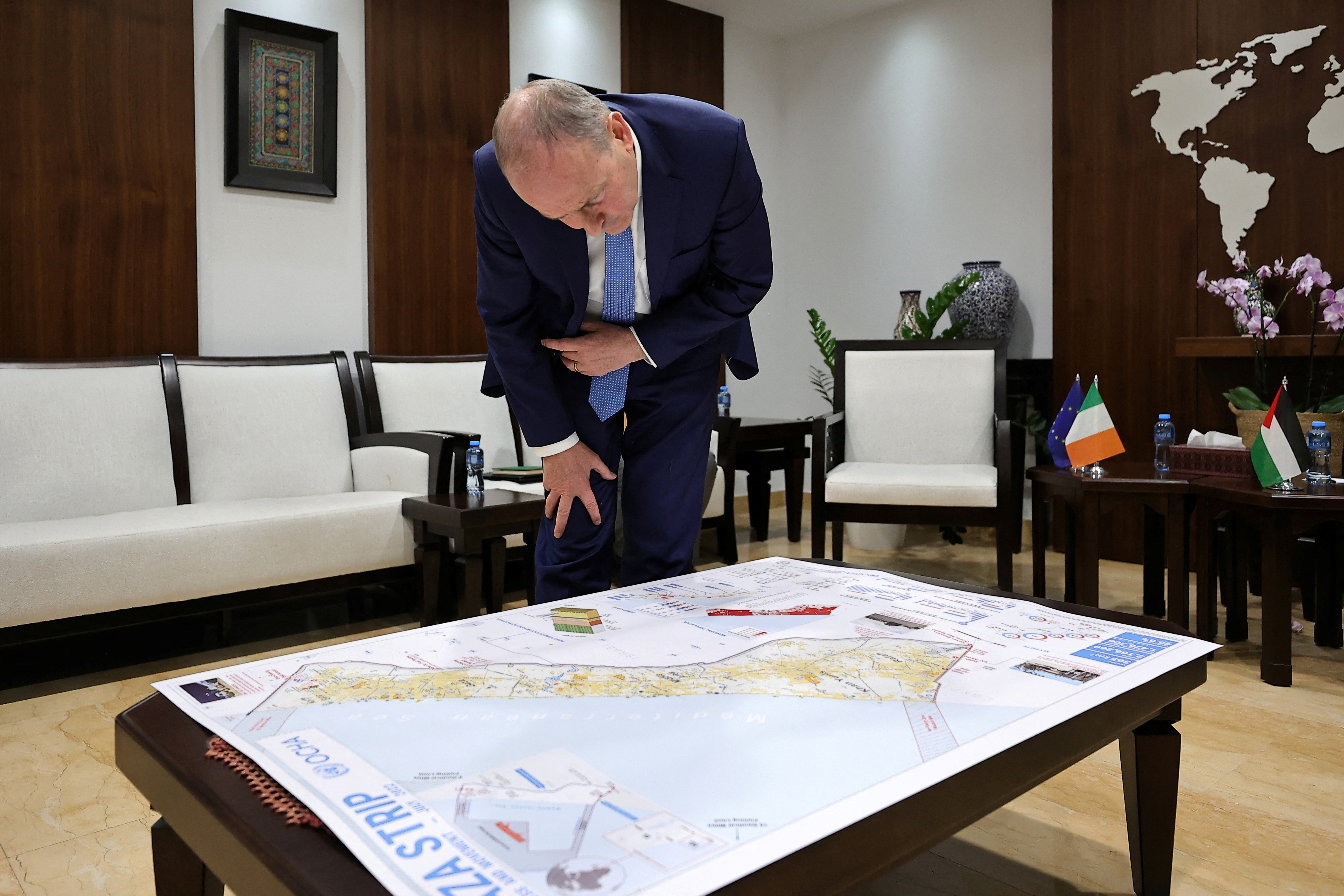 Irish Defence and Foreign Affairs Minister Micheal Martin looks at a map of the Gaza Strip during a meeting with Palestinian Prime Minister Mohammad Shtayyeh in Ramallah, amid the ongoing battles between Israel and the Palestinian group Hamas, November 16, 2023. ZAIN JAAFAR/Pool via REUTERS