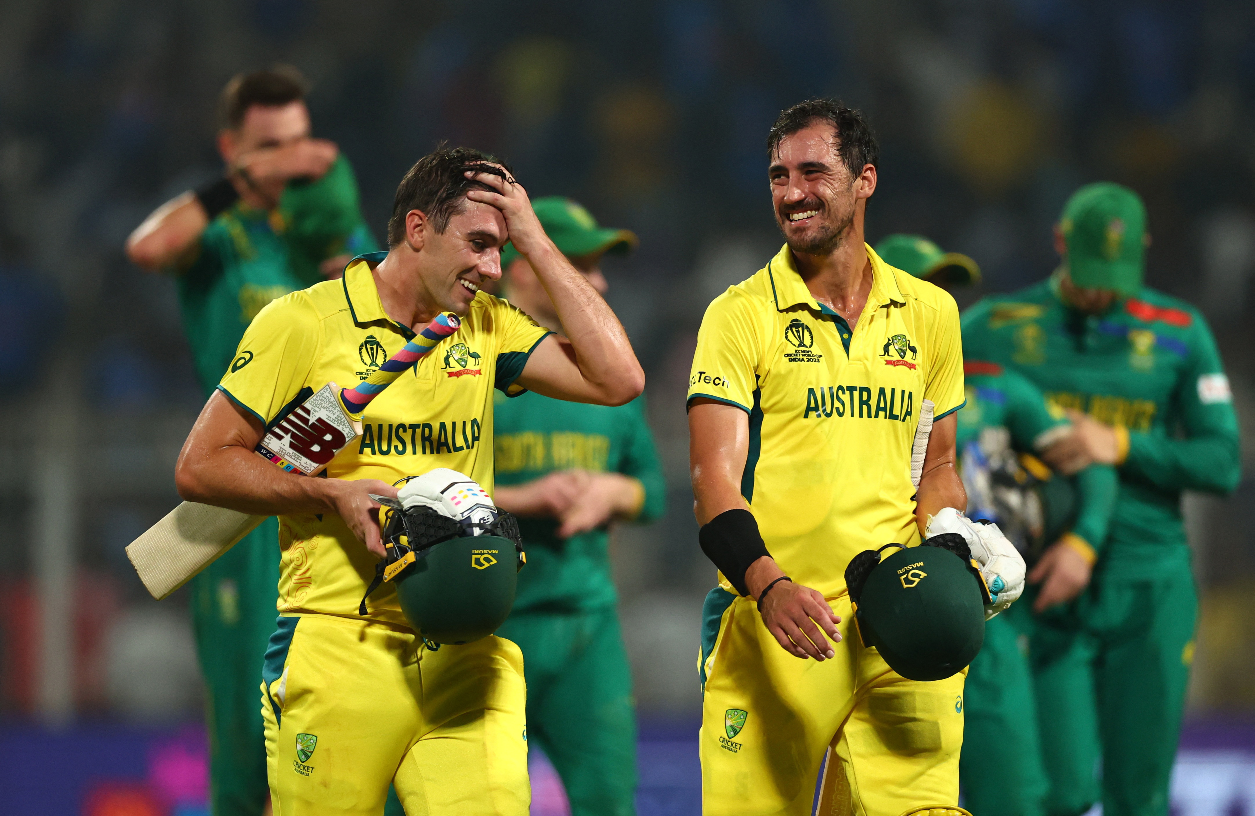 Australia's Pat Cummins and Mitchell Starc celebrate