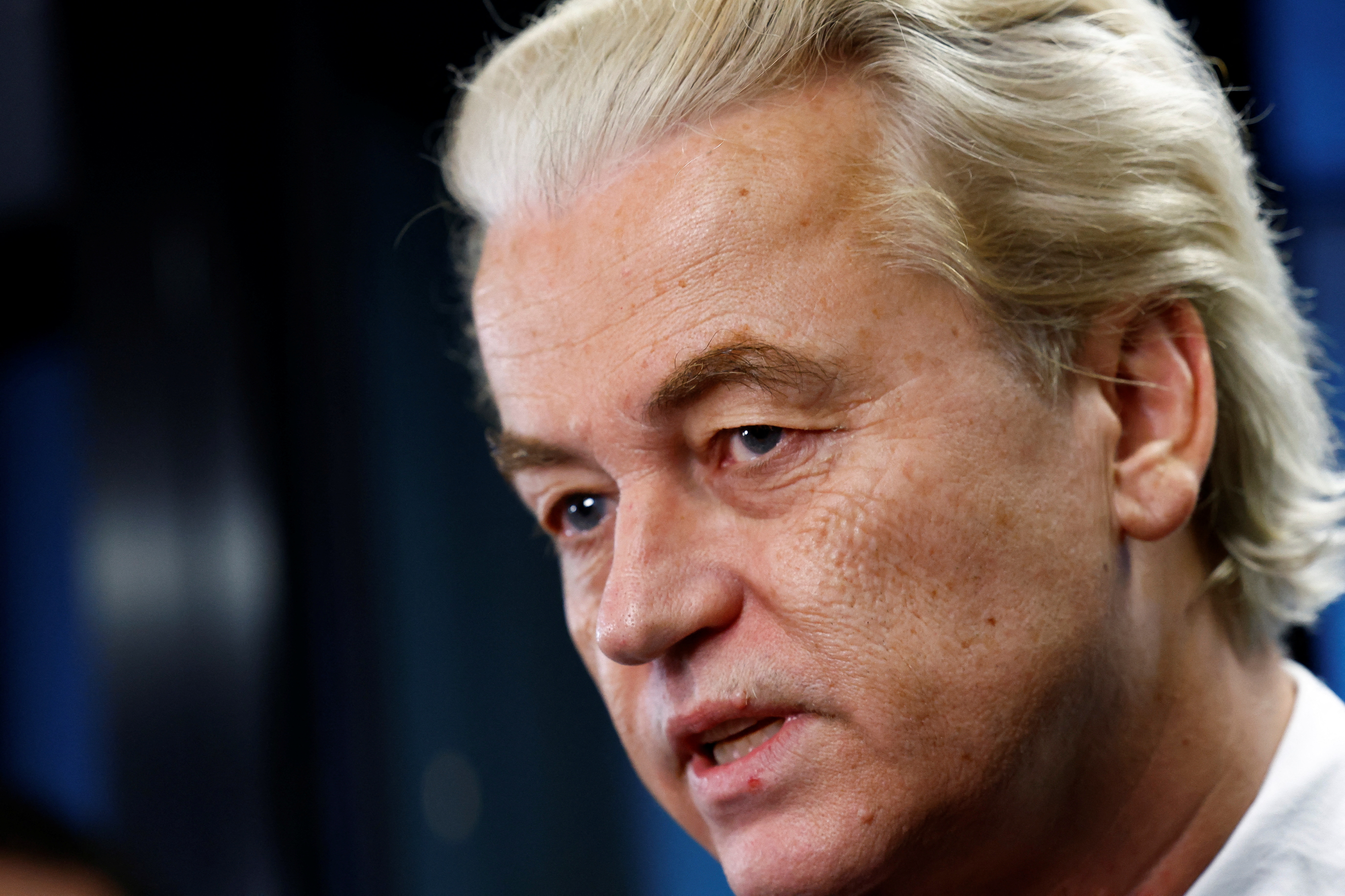 Dutch far-right politician and leader of the PVV party Geert Wilders reacts as he meets the press as Dutch parties' lead candidates meet for the first time after elections, in which far-right politician Geert Wilders booked major gains, to begin coalition talks in The Hague, Netherlands, November 24, 2023. REUTERS/Piroschka van de Wouw