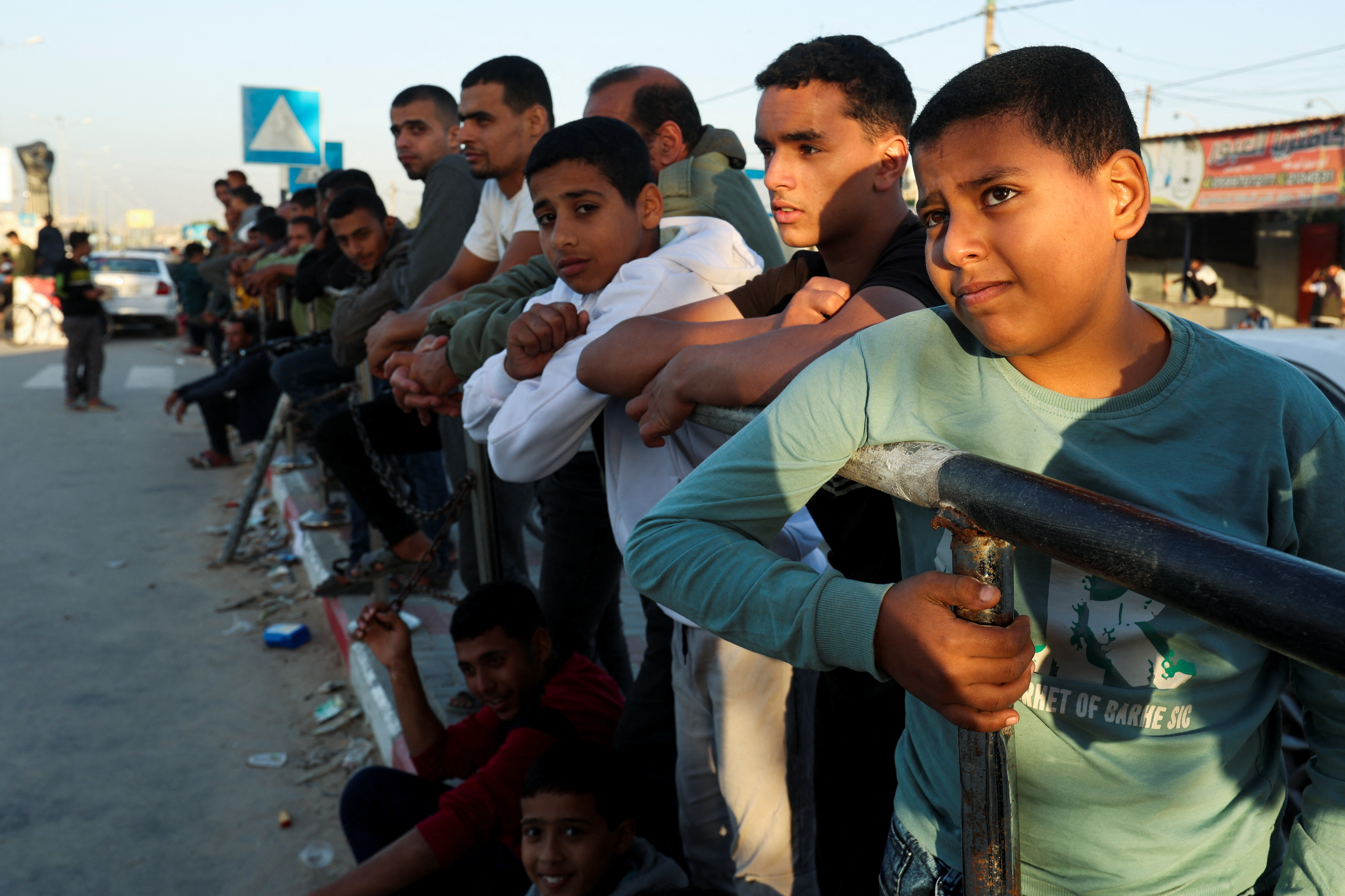 People gather at Rafah border as Hamas militants are expected to release hostages abducted by Hamas