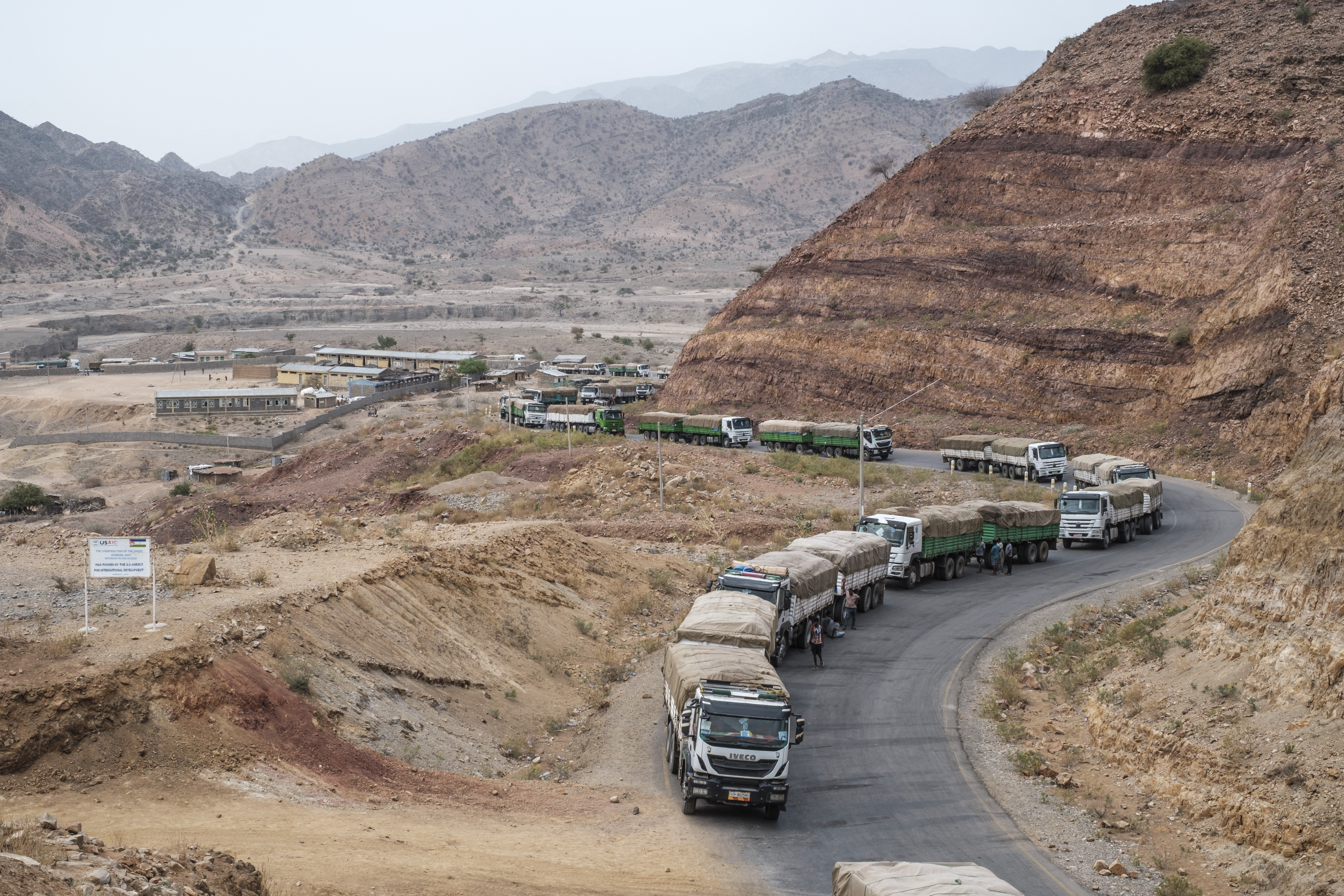 A convoy of trucks part of a convoy of the World Food Programme (WFP) on their way to Tigray are seen in the village of Erebti, Ethiopia.