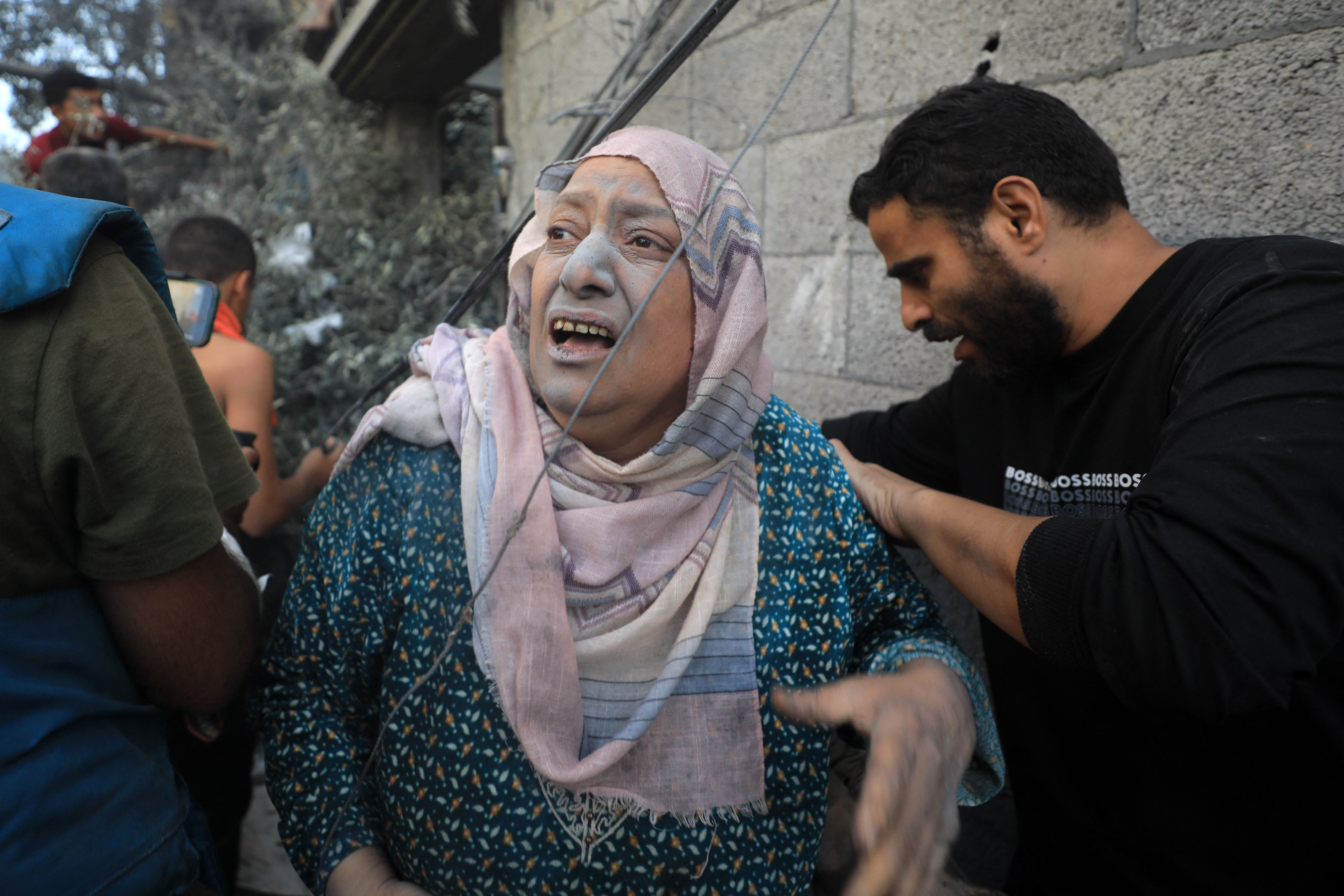 People flee following Israeli air strikes on a neighbourhood in the al-Maghazi refugee camp in the central Gaza Strip on November 6, 2023, amid ongoing battles between Israel and the Palestinian Hamas movement. - Thousands of civilians, both Palestinians and Israelis, have died since October 7