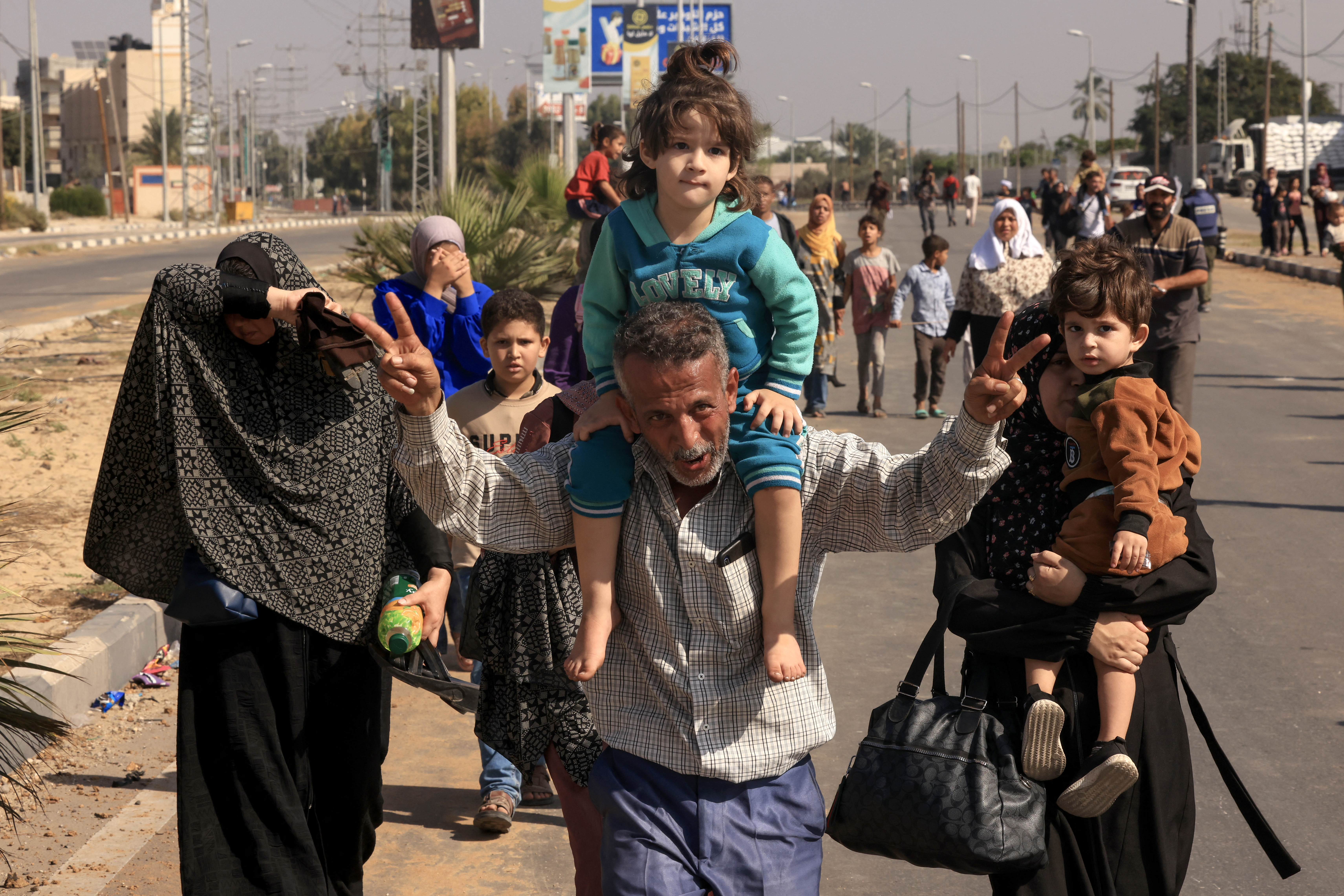 Palestinians fleeing Gaza City towards the southern areas walk on a road on November 7, 2023, amid the ongoing battles between Israel and the Palestinian Islamist group Hamas.