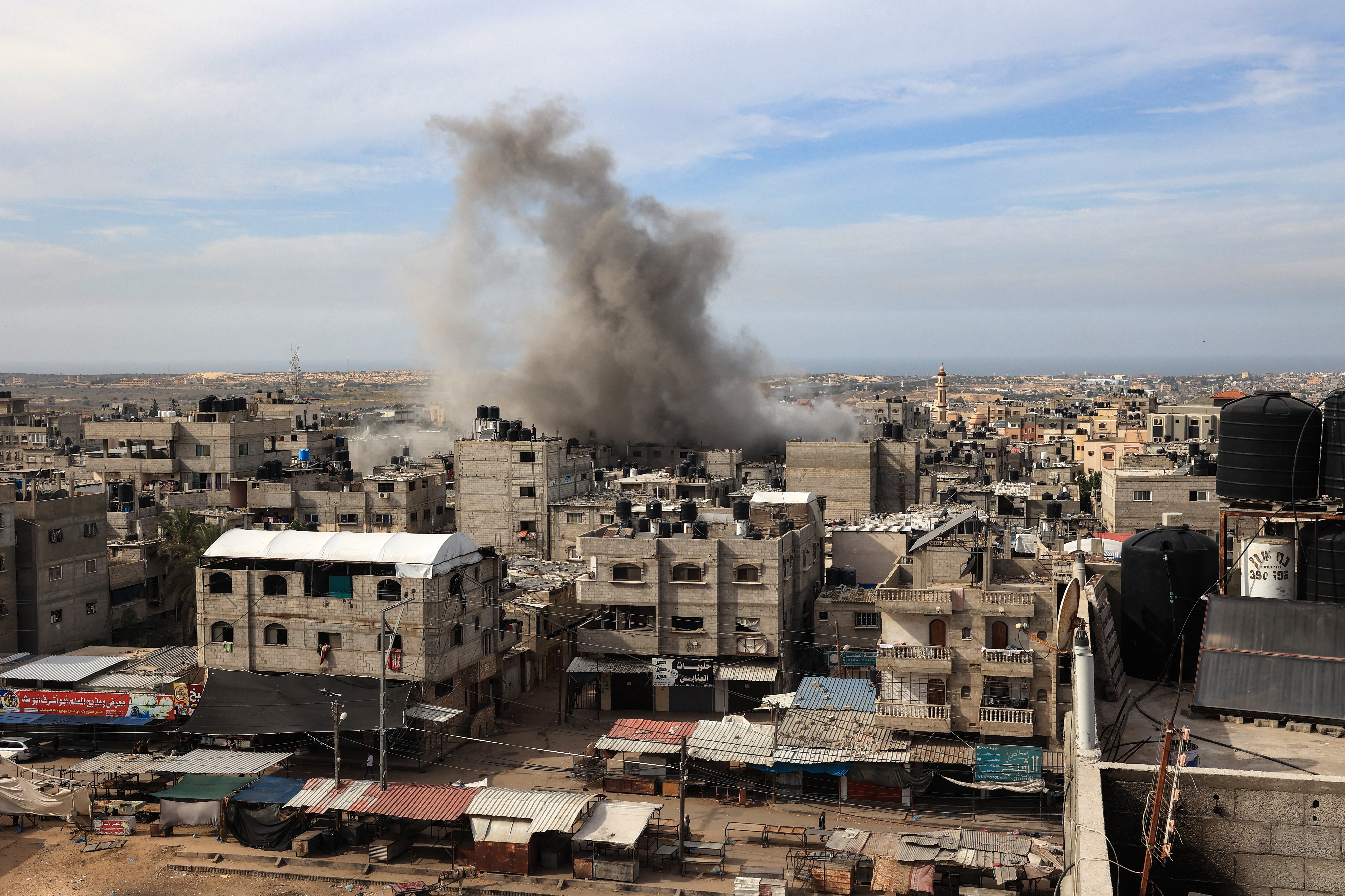 Smoke rises above houses during Israeli bombing on Rafah in the southern Gaza Strip